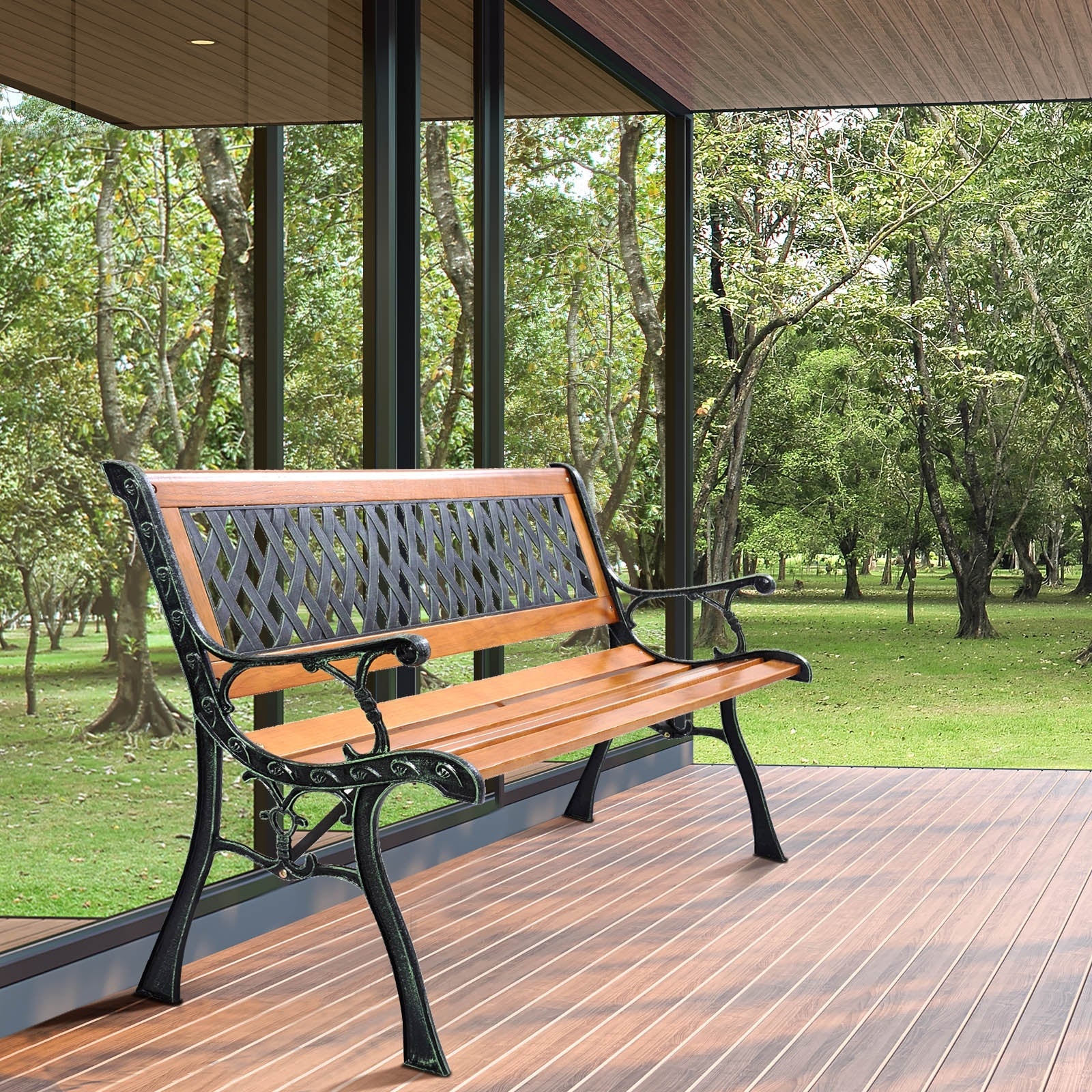 Outdoor Cast Iron Patio Bench with wood seat and PVC backrest on a wooden deck overlooking a scenic park.