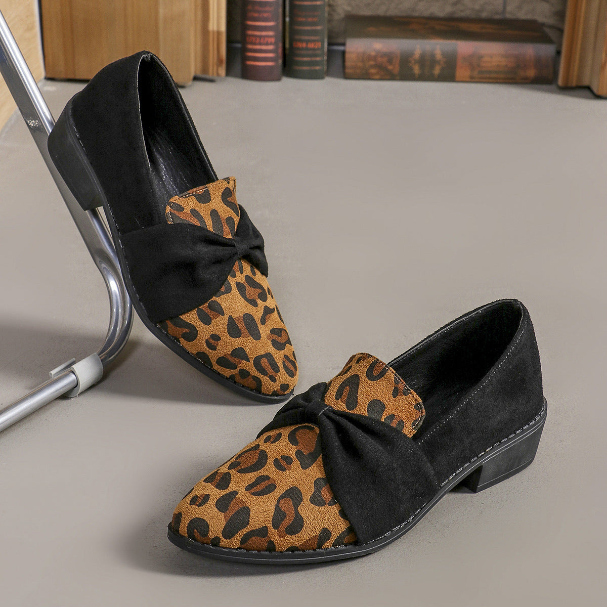 Women's Leopard Print Pumps with chic bow accent on beige leopard pattern, perfect for casual and bold fashion looks.