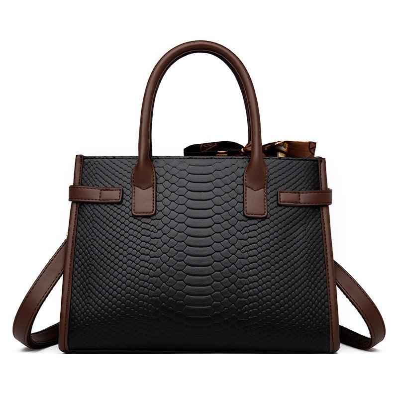 Serpent Luxe Snakeskin Handbag - Elegant Leather Commuter Bag for Stylish Women in black and brown with texture detail.