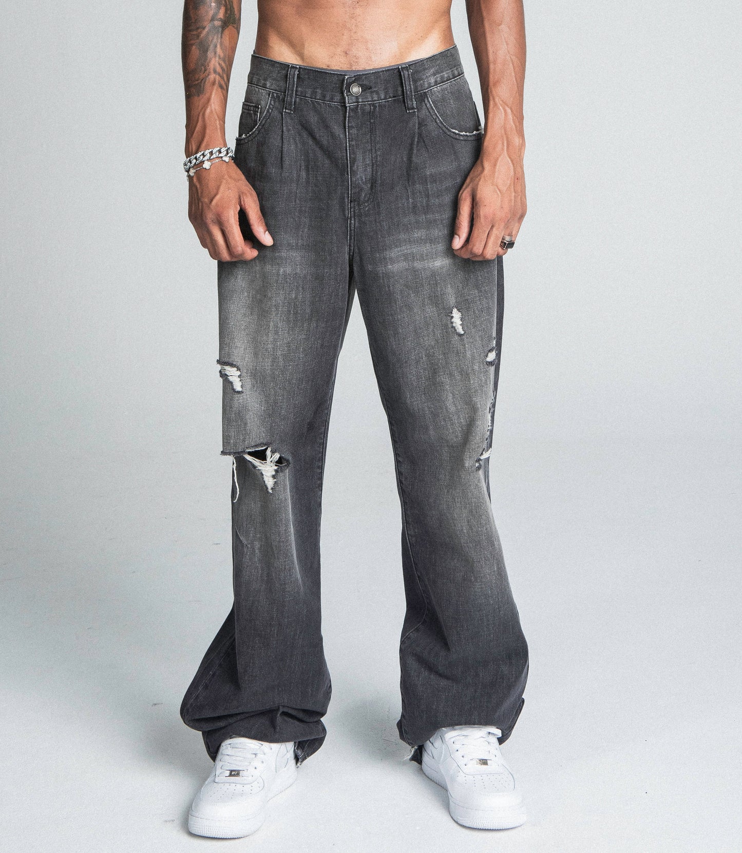 AJ09B-2 BLACK DISTRESSED BAGGY JEANS with five-pocket design, mid-rise, loose-fit, zipper fly, and faded details. Made from cotton fabric.