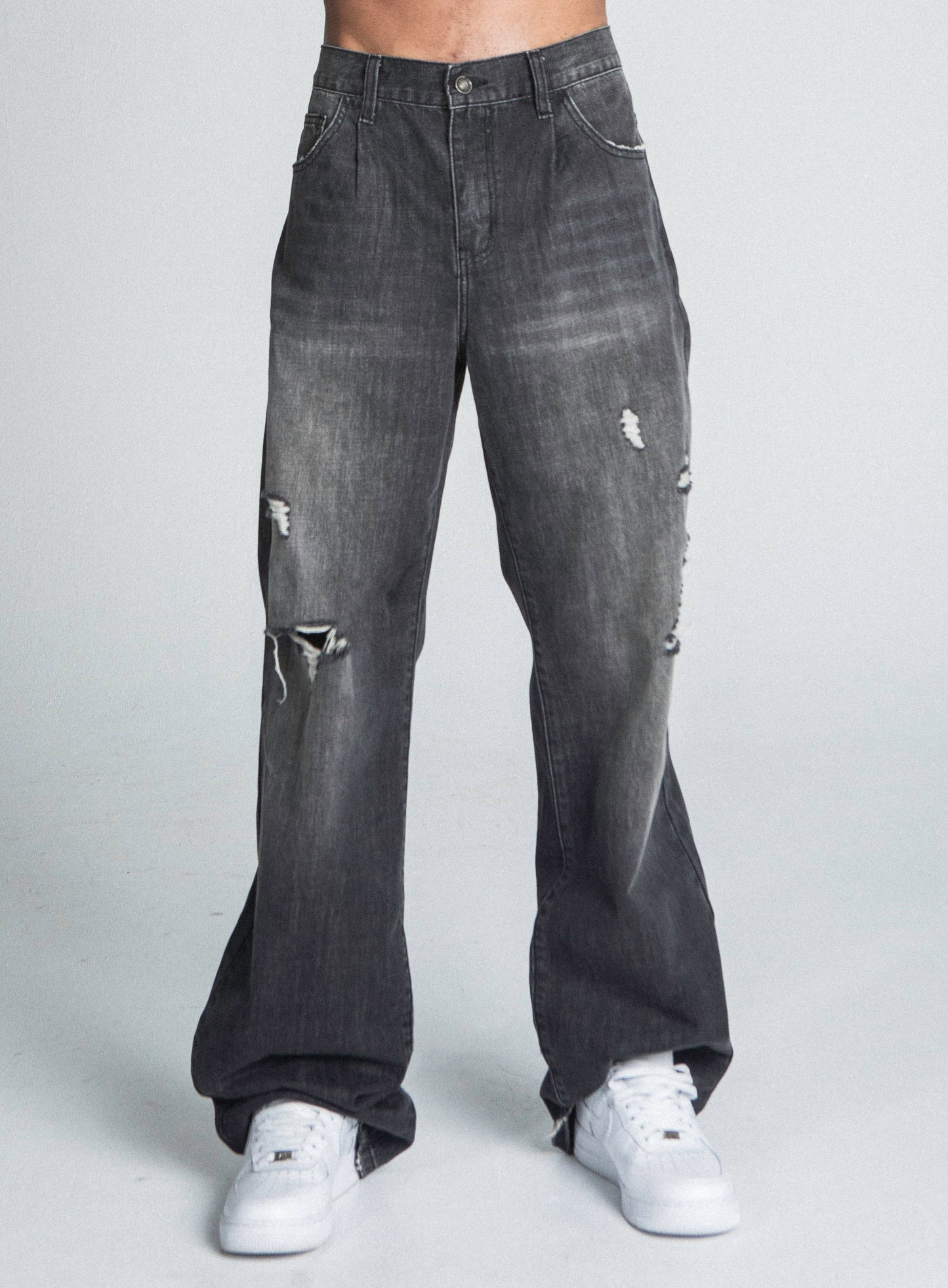 AJ09B-2 BLACK DISTRESSED BAGGY JEANS with mid-rise, loose-fit, faded details, and five-pocket design made from cotton.