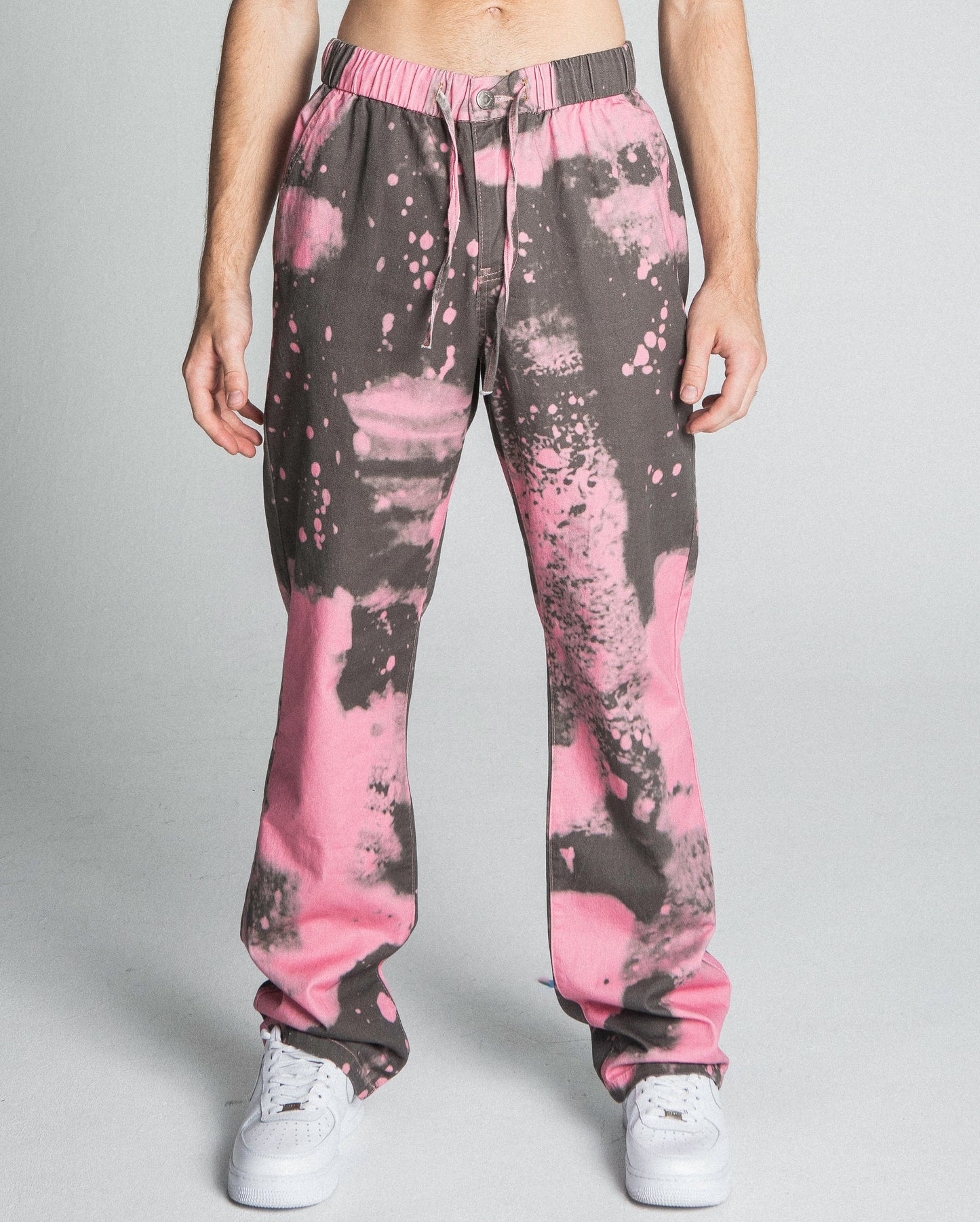 AJ04SK COLOR DYE STACKED JEANS in pink, featuring mid-rise, straight-leg design, five-pocket style, and elastic band fastening.