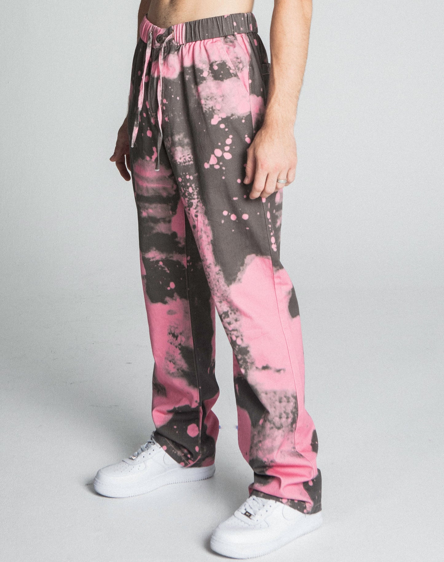 AJ04SK COLOR DYE STACKED JEANS in pink with mid-rise waist, straight-leg fit, and five-pocket design, featuring color dye details and elastic band.