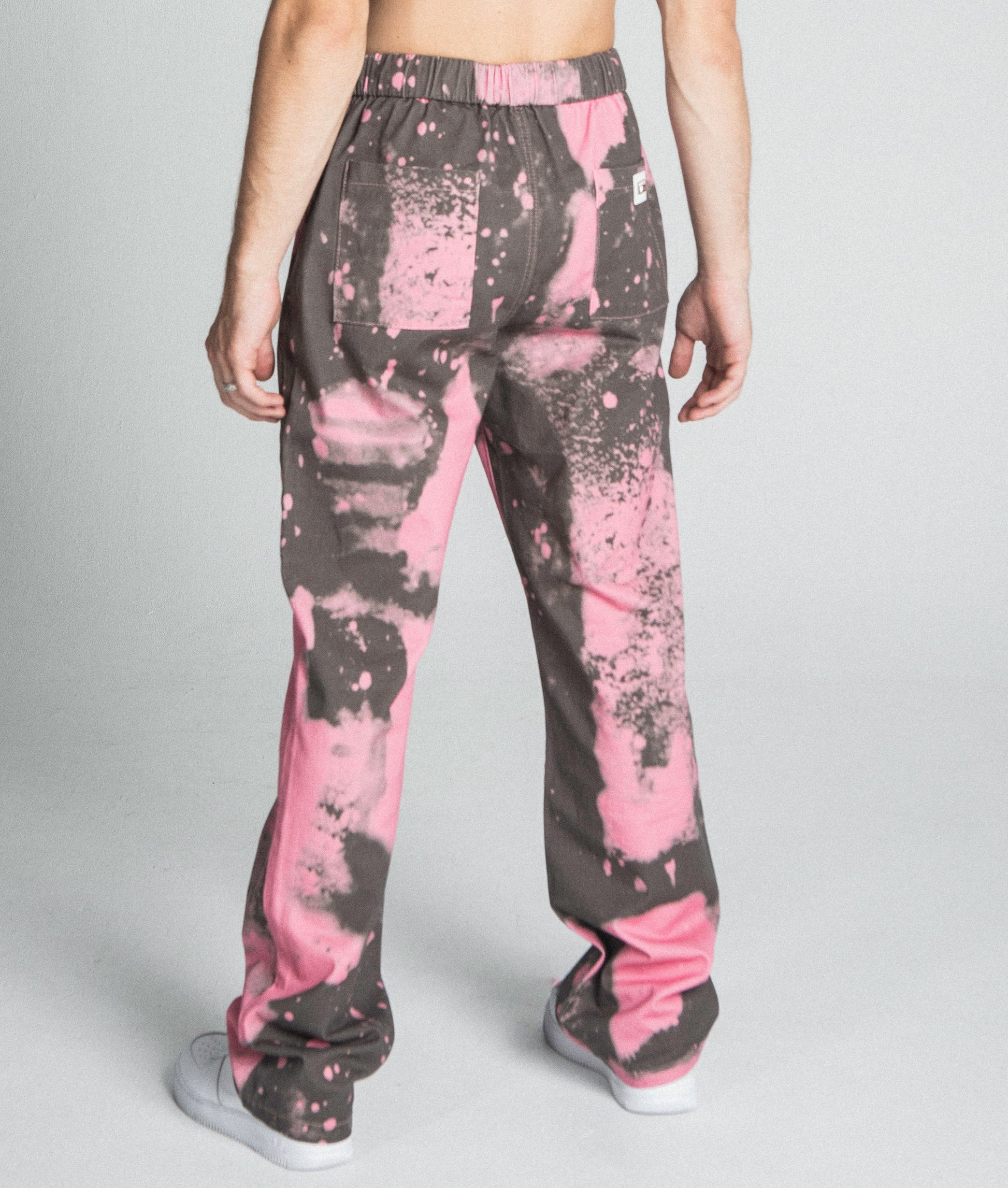 AJ04SK COLOR DYE STACKED JEANS in pink with mid-rise, straight-leg design and five-pocket style, back view showcasing color dye detail.