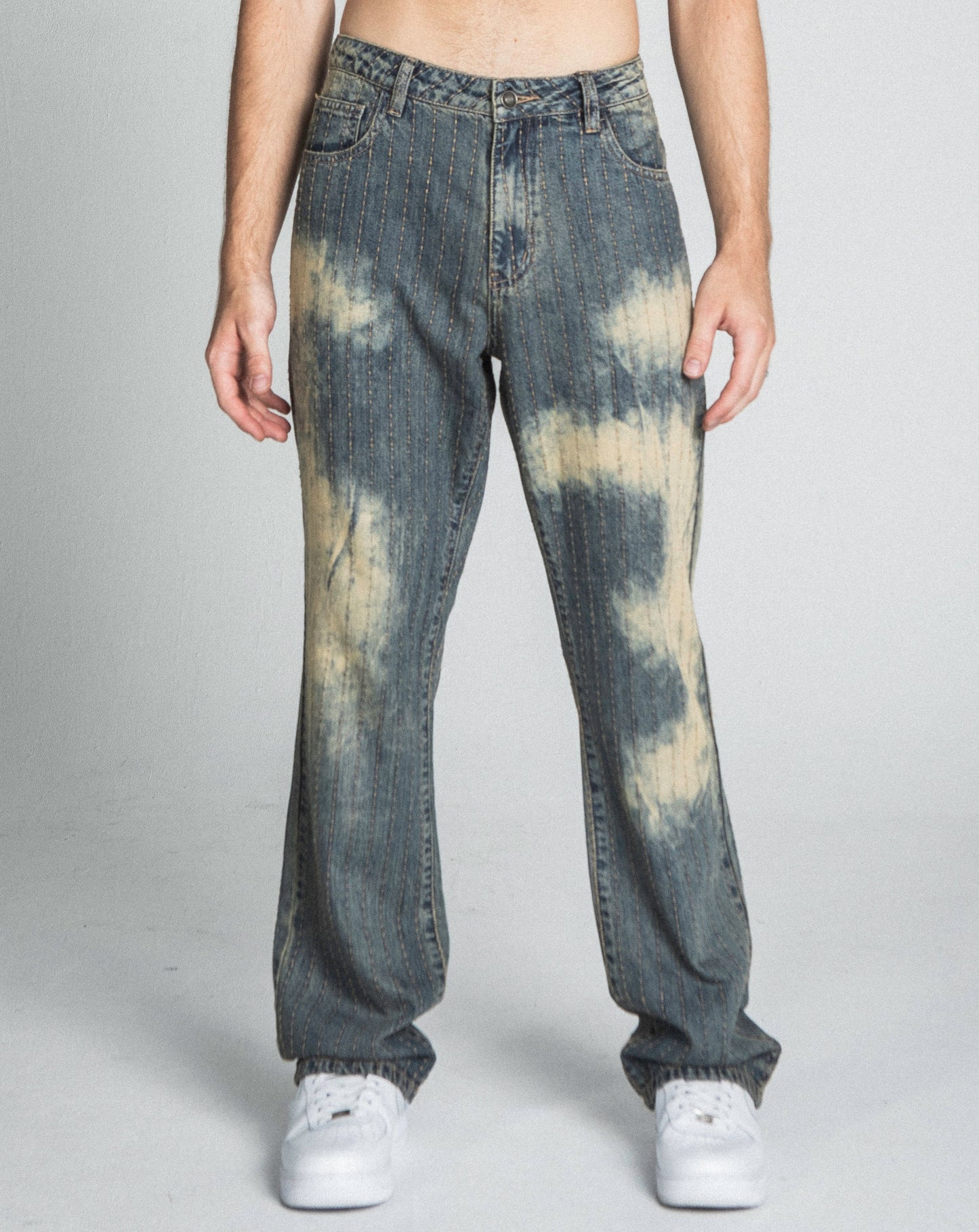 Model wearing AJ01L-3 VINTAGE THREAD LINE LOOSE JEANS, mid-rise, straight-leg, five-pocket design, in faded denim, 100% cotton.