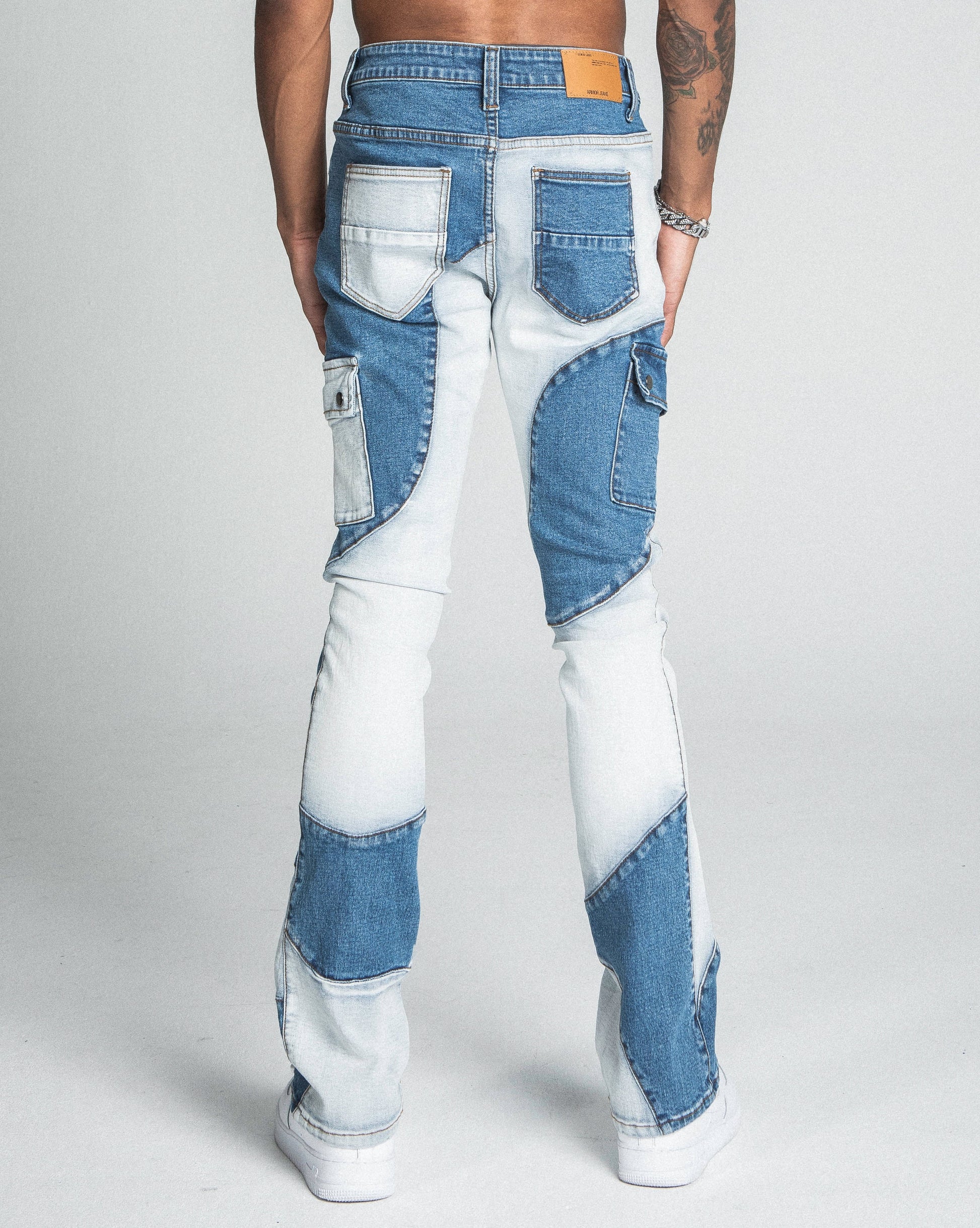 Rear view of AJ40SK COLOR BLOCK STACKED JEANS, featuring stretchy cotton fabric, mid rise waist, and unique color block design.