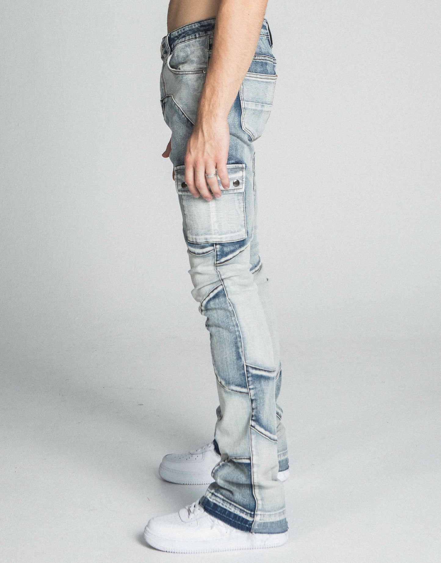 Side view of AJ40SK COLOR BLOCK STACKED JEANS featuring mid-rise waist, stretchy fabric, and five-pocket design