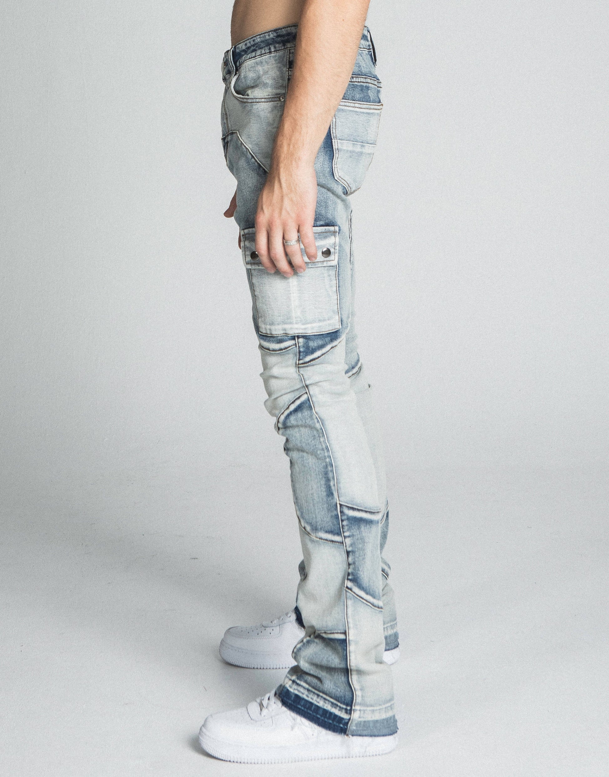 Side view of AJ40SK COLOR BLOCK STACKED JEANS featuring mid-rise waist, stretchy fabric, and five-pocket design