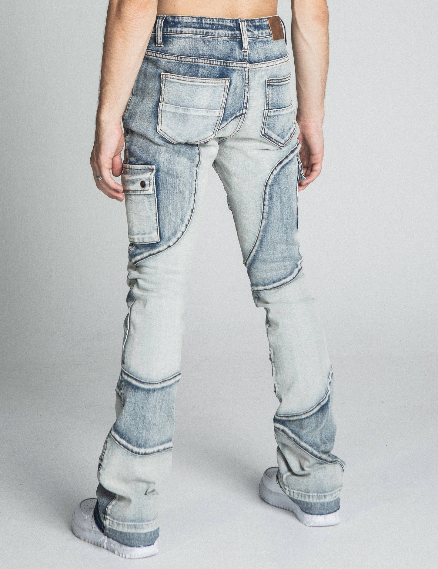 Back view of AJ40SK COLOR BLOCK STACKED JEANS in light blue with mid rise and stretchy cotton fabric, featuring a stacked leg design.