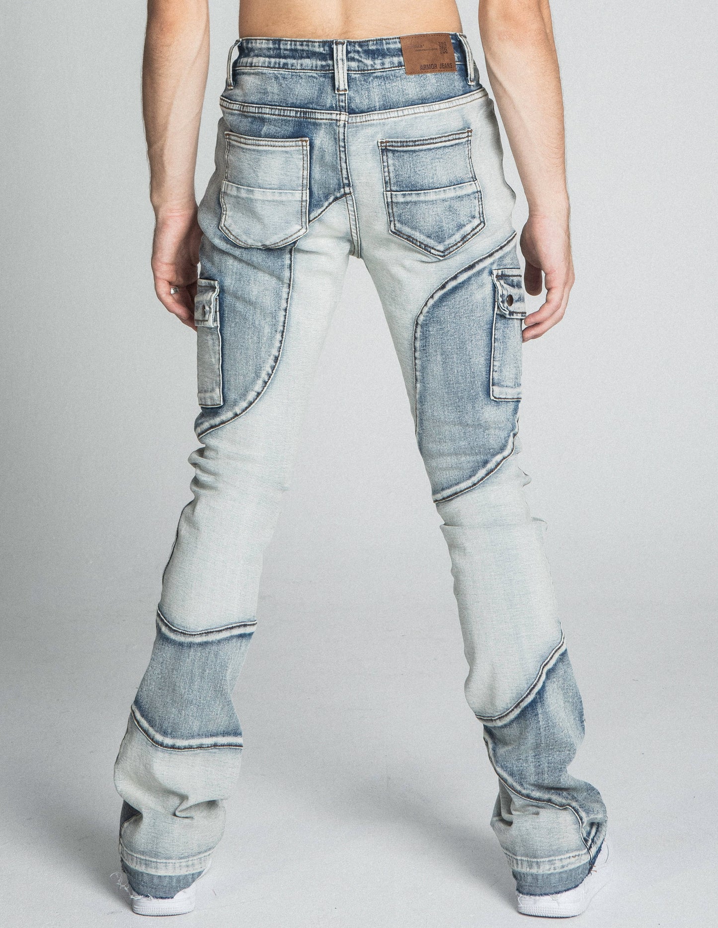 Back view of AJ40SK COLOR BLOCK STACKED JEANS showcasing mid-rise waist and unique color block design.