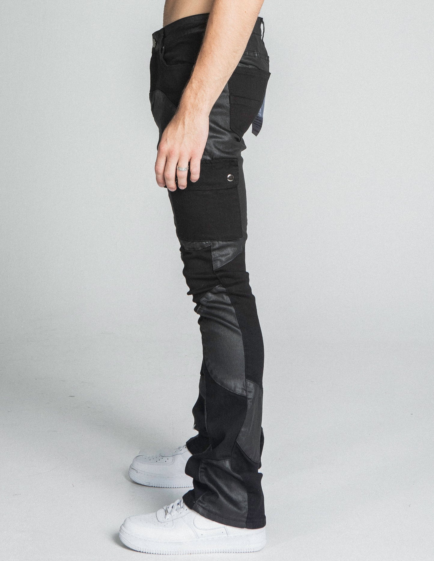 AJ40SK COLOR BLOCK STACKED JEANS with stretchy cotton fabric, mid-rise waist, and color block design shown in side profile.