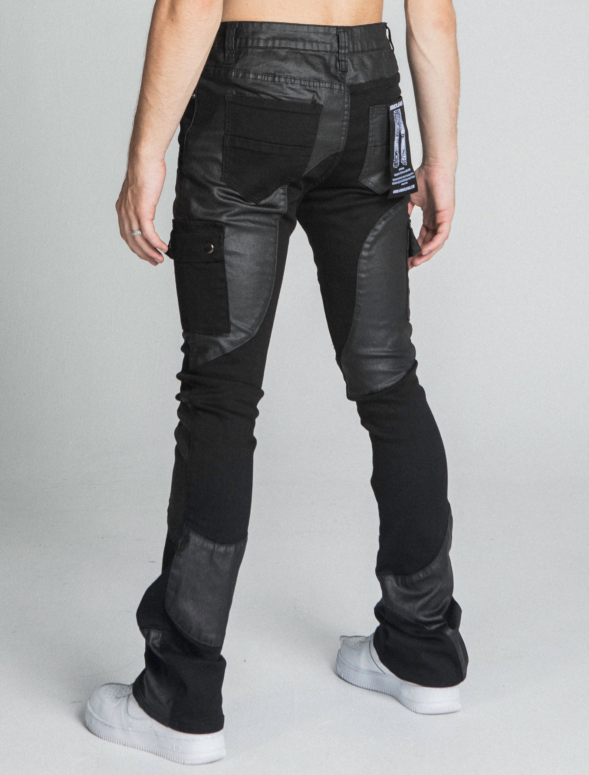 Back view of AJ40SK COLOR BLOCK STACKED JEANS, showcasing stretchy fabric and unique color block design, mid-rise waist, and five-pocket style.