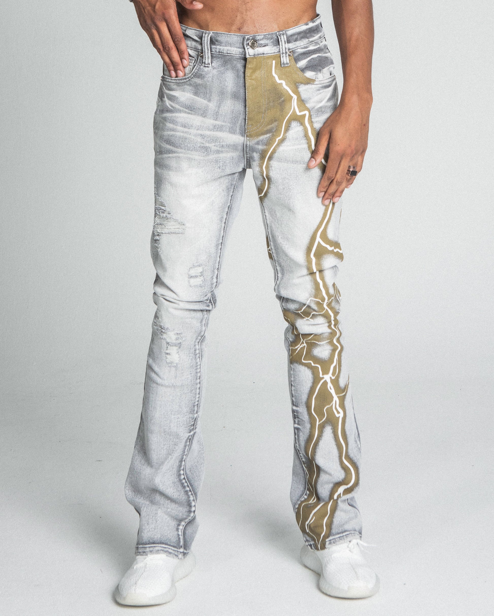 AJ24SK LIGHTNING STACKED JEANS with mid-rise waist, stretchy cotton fabric, and distinctive lightning design on stacked legs.