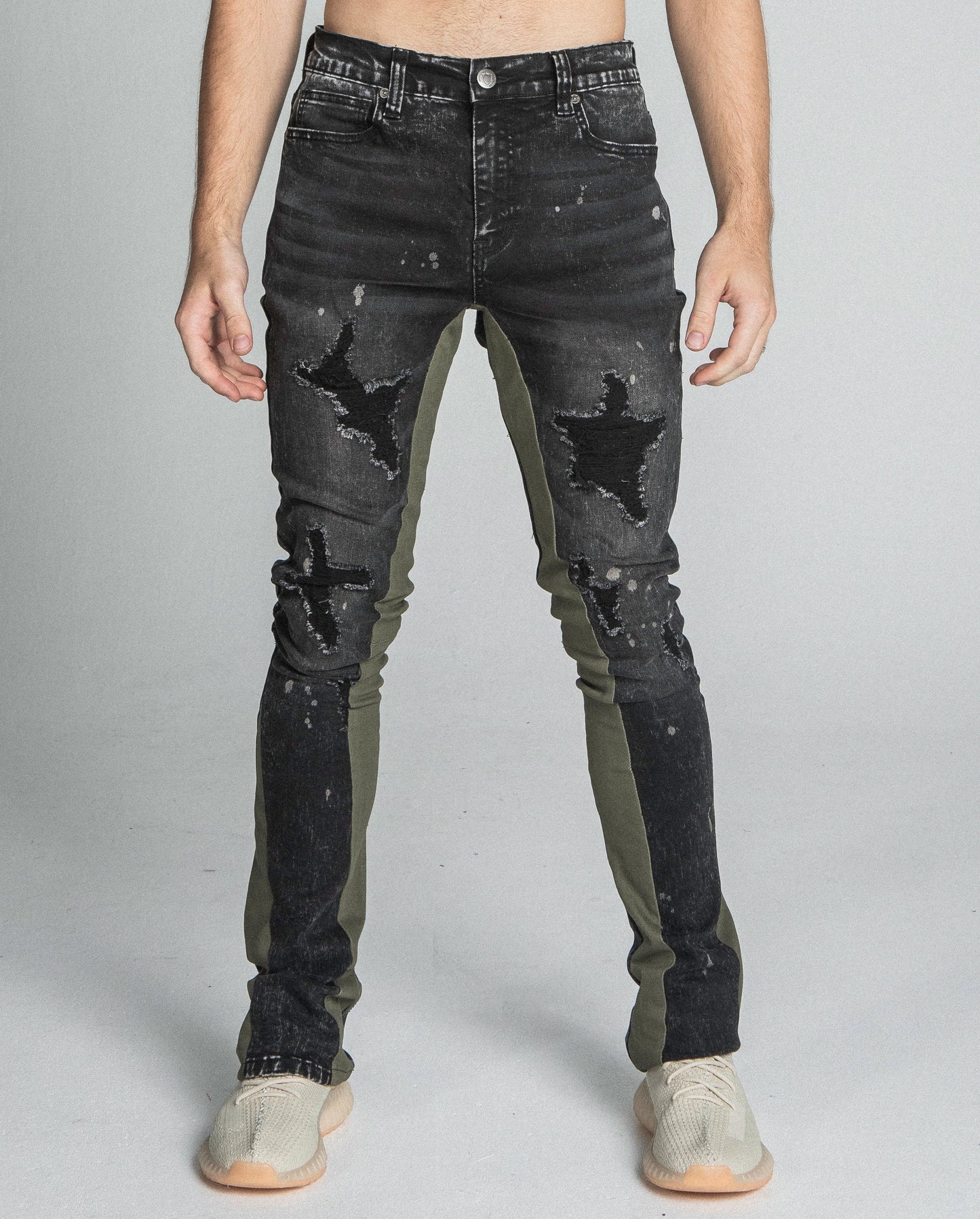 AR711 BLACK/BROWM DISTRESSED STAR STACKED JEANS with black stretchy fabric, mid-rise waist, and unique star design.