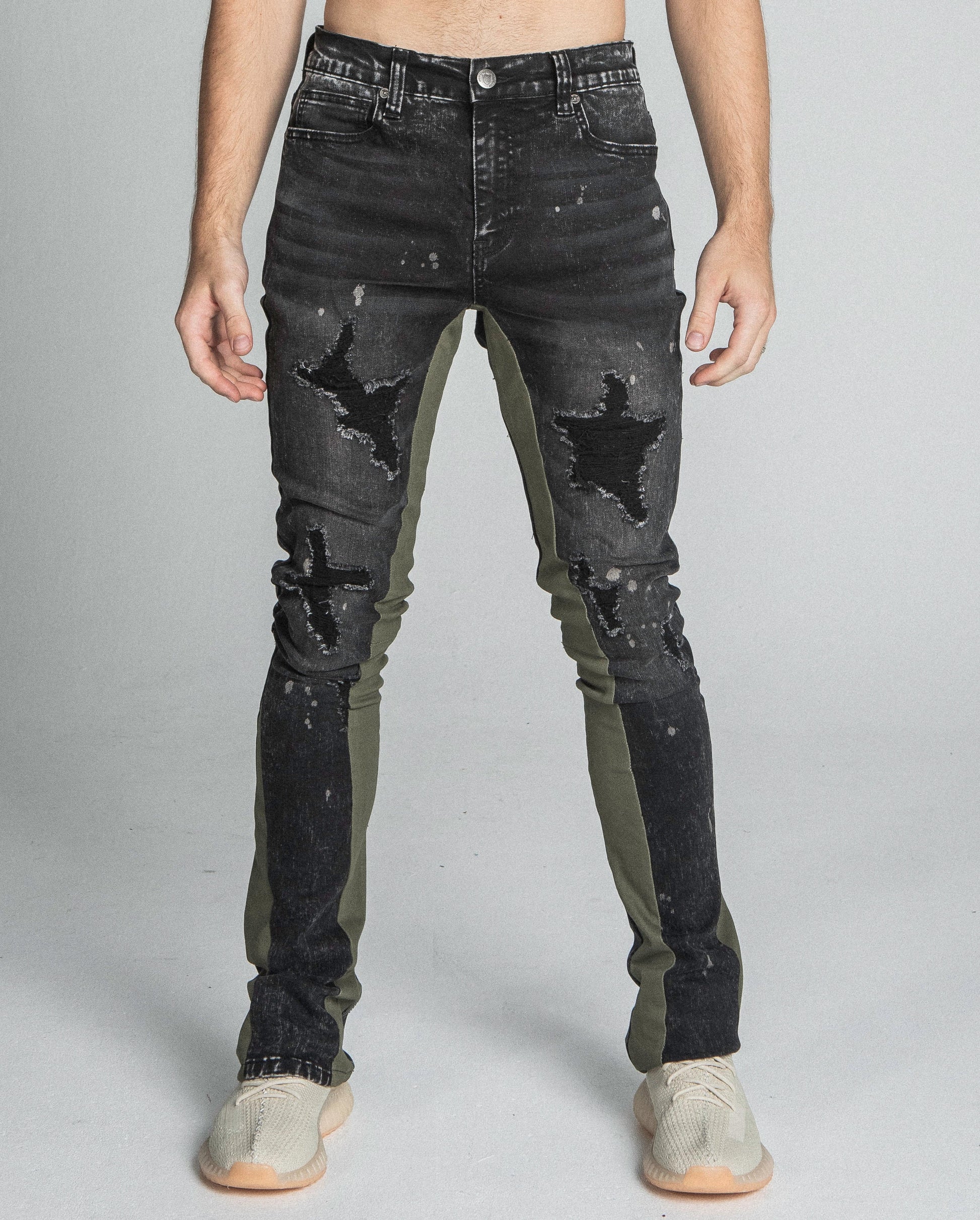 AR711 BLACK/BROWM DISTRESSED STAR STACKED JEANS with black stretchy fabric, mid-rise waist, and unique star design.