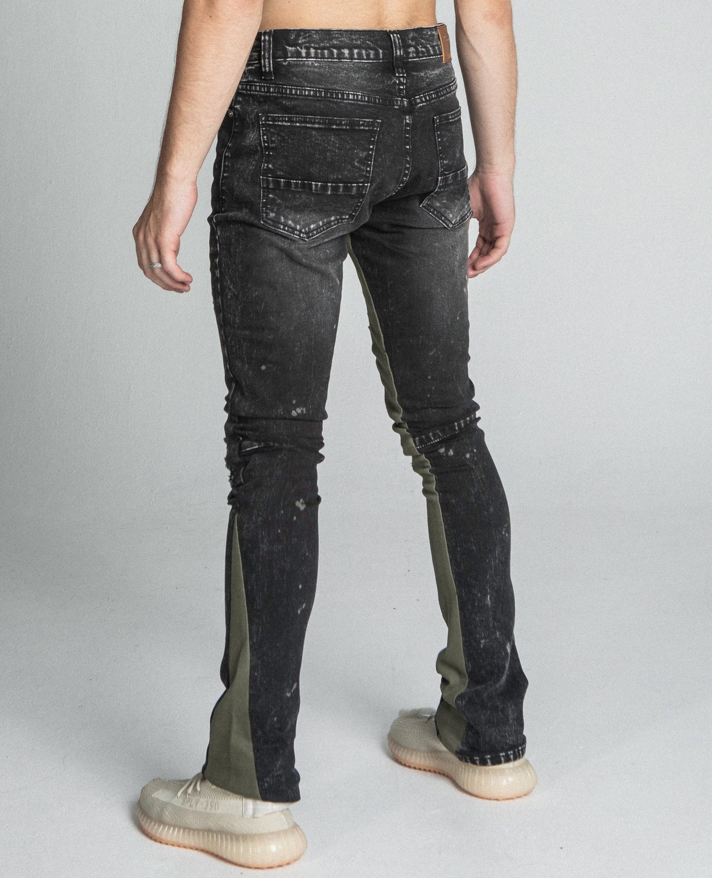 Back view of AR711 BLACK/BROWM DISTRESSED STAR STACKED JEANS with mid rise waist and stretchy fabric.