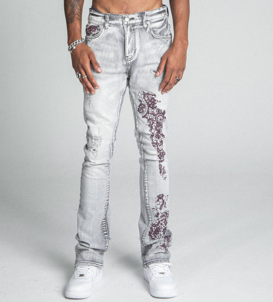 AJ27SK LACE FADED WASH STACKED JEANS with lace details, mid-rise waist, stretchy fabric, five-pocket design, zipper fly, and top button.