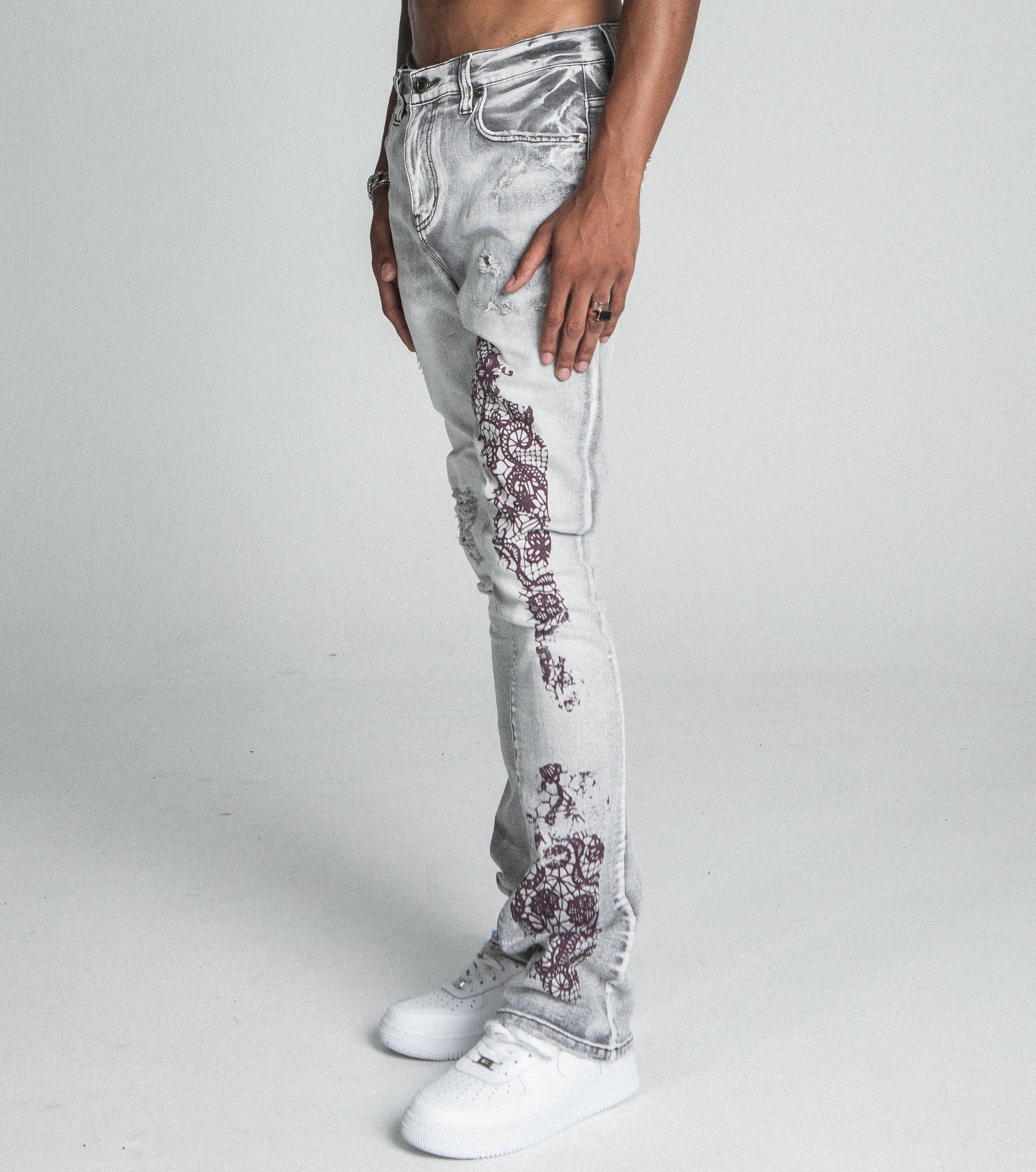AJ27SK LACE FADED WASH STACKED JEANS with lace accents and five-pocket design in side view