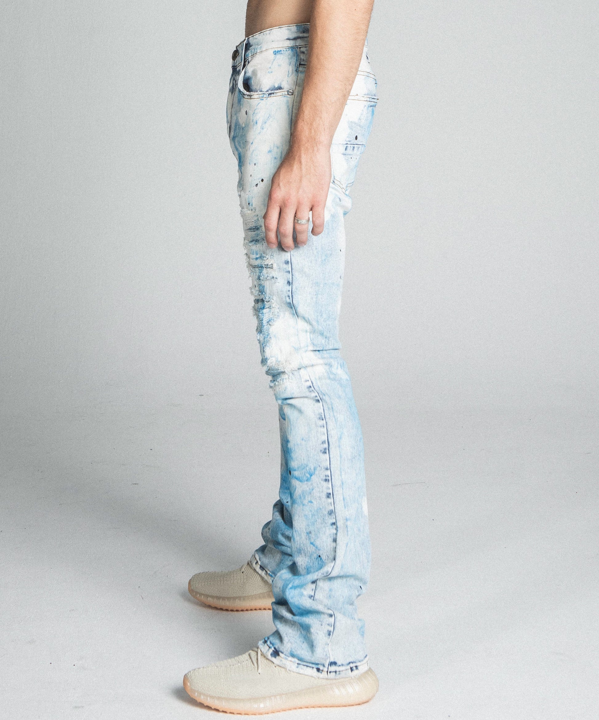AJ28SK LIGHT BLUE/WHITE PAINT STACKED JEANS with mid-rise waist, stretchy fabric, five-pocket design, and zipper fly.