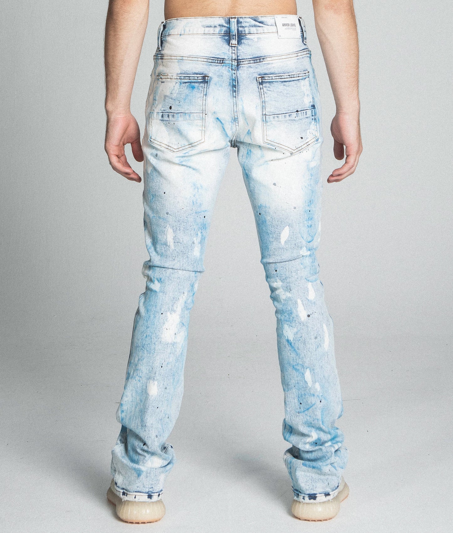 AJ28SK LIGHT BLUE/WHITE PAINT STACKED JEANS with mid-rise waist and stretchy cotton fabric, featuring a five-pocket design.