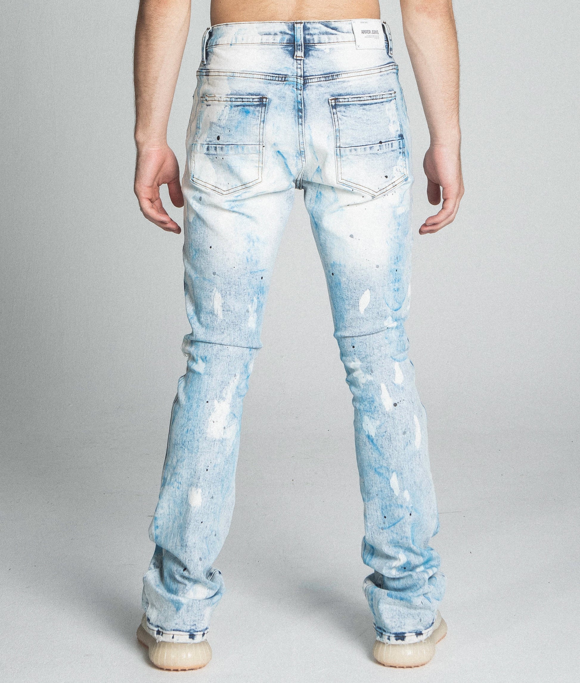 AJ28SK LIGHT BLUE/WHITE PAINT STACKED JEANS with mid-rise waist and stretchy cotton fabric, featuring a five-pocket design.