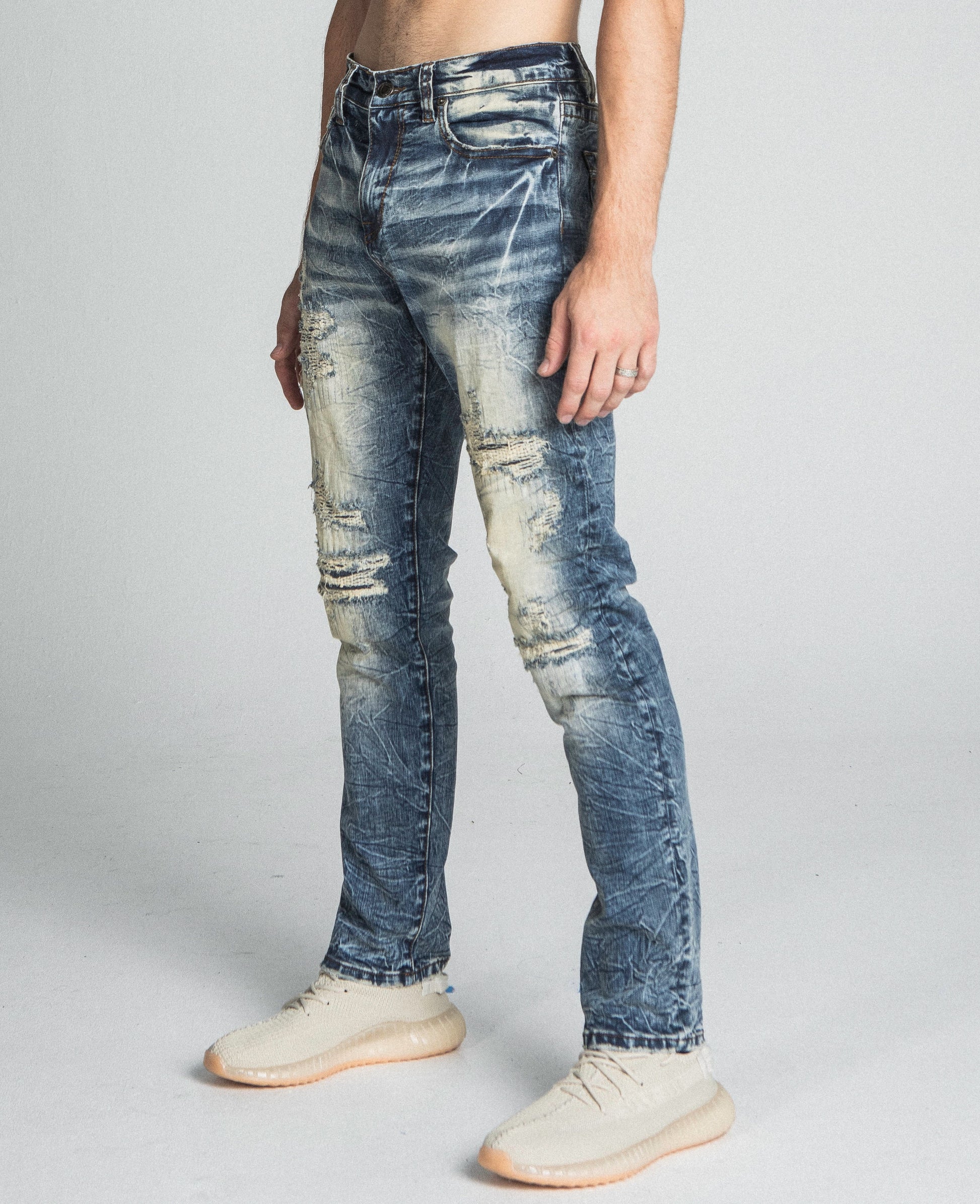 AJ722SL-1 RIPPED VINTAGE SLIM JEANS in blue with mid-rise waist, stretchy fabric, five-pocket design, and distressed detailing.
