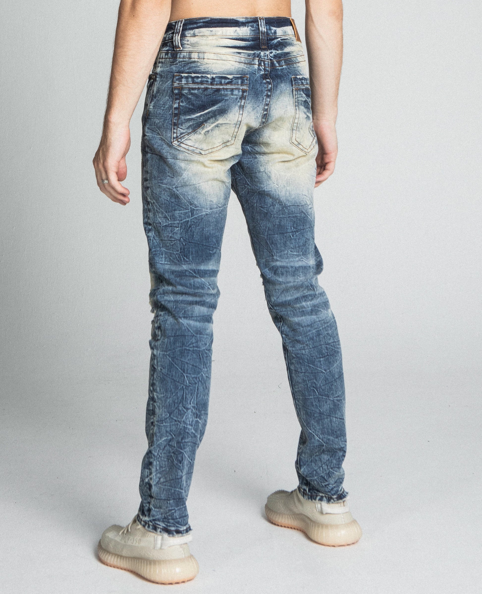 Back view of AJ722SL-1 RIPPED VINTAGE SLIM JEANS showing ripped design and fit