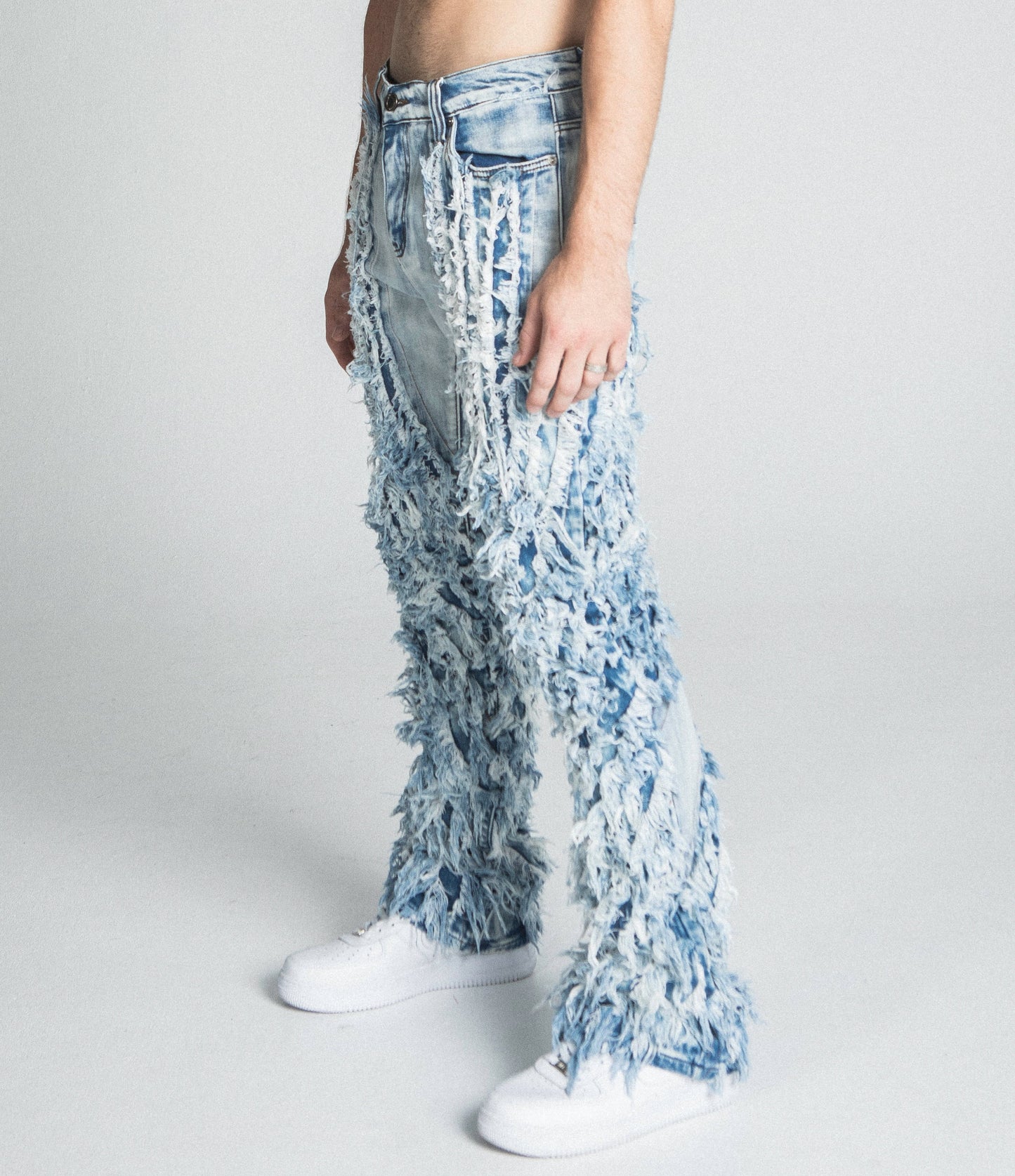 AJ18SK EXTREME FRAYED STACKED JEANS with mid rise, stretchy fabric, and traditional wash, featuring belt loops and zipper fly