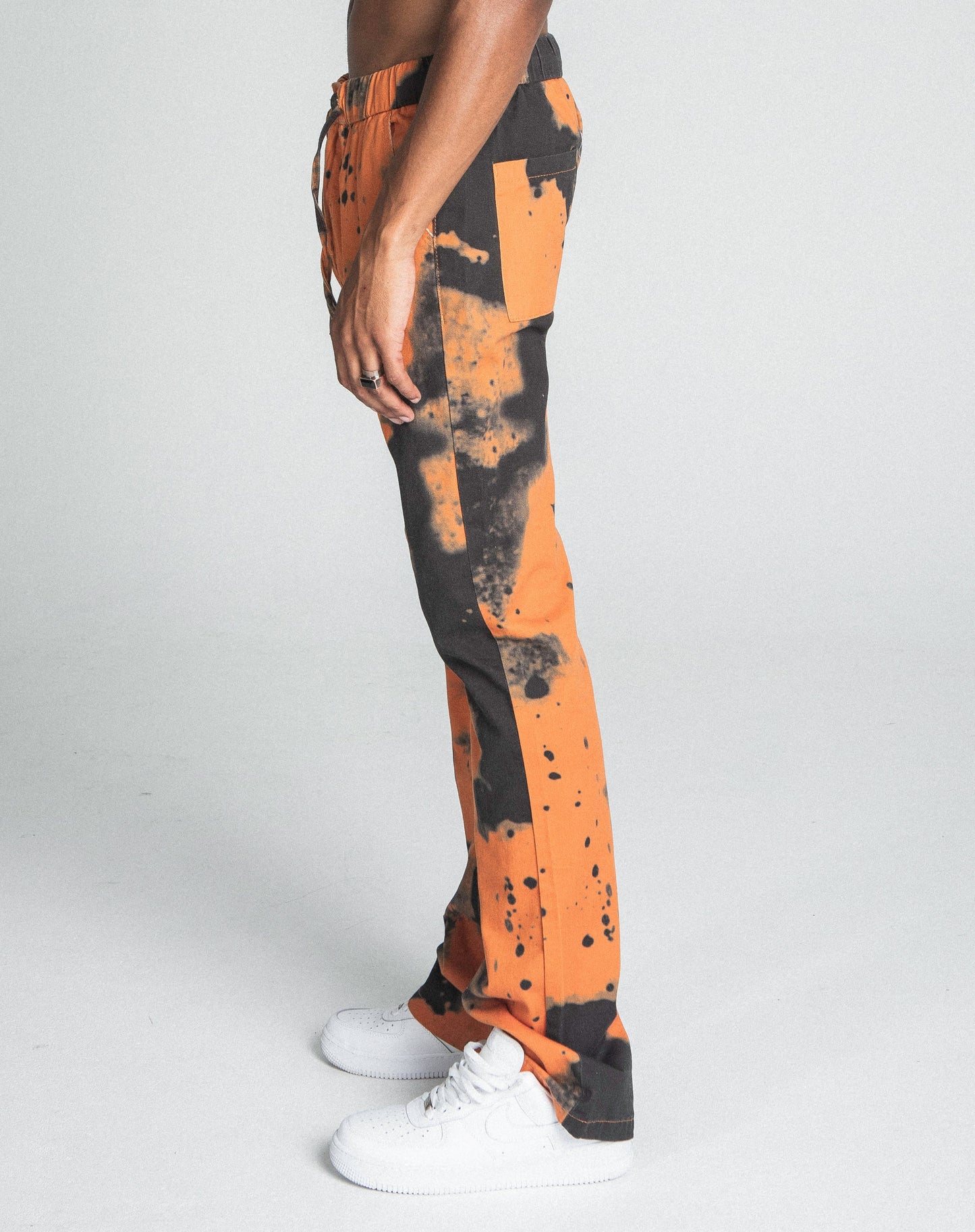 AJ04SK COLOR DYE STACKED JEANS in orange with a straight-leg design, mid-rise waist, and color dye details, featuring a five-pocket style.