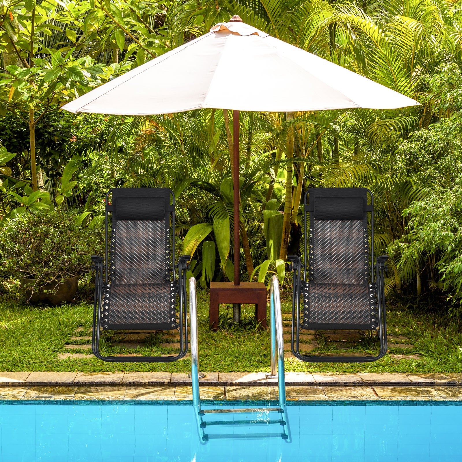 2 Pieces Folding Patio Rattan Zero Gravity Lounge Chair-Brown by a pool with a sun umbrella