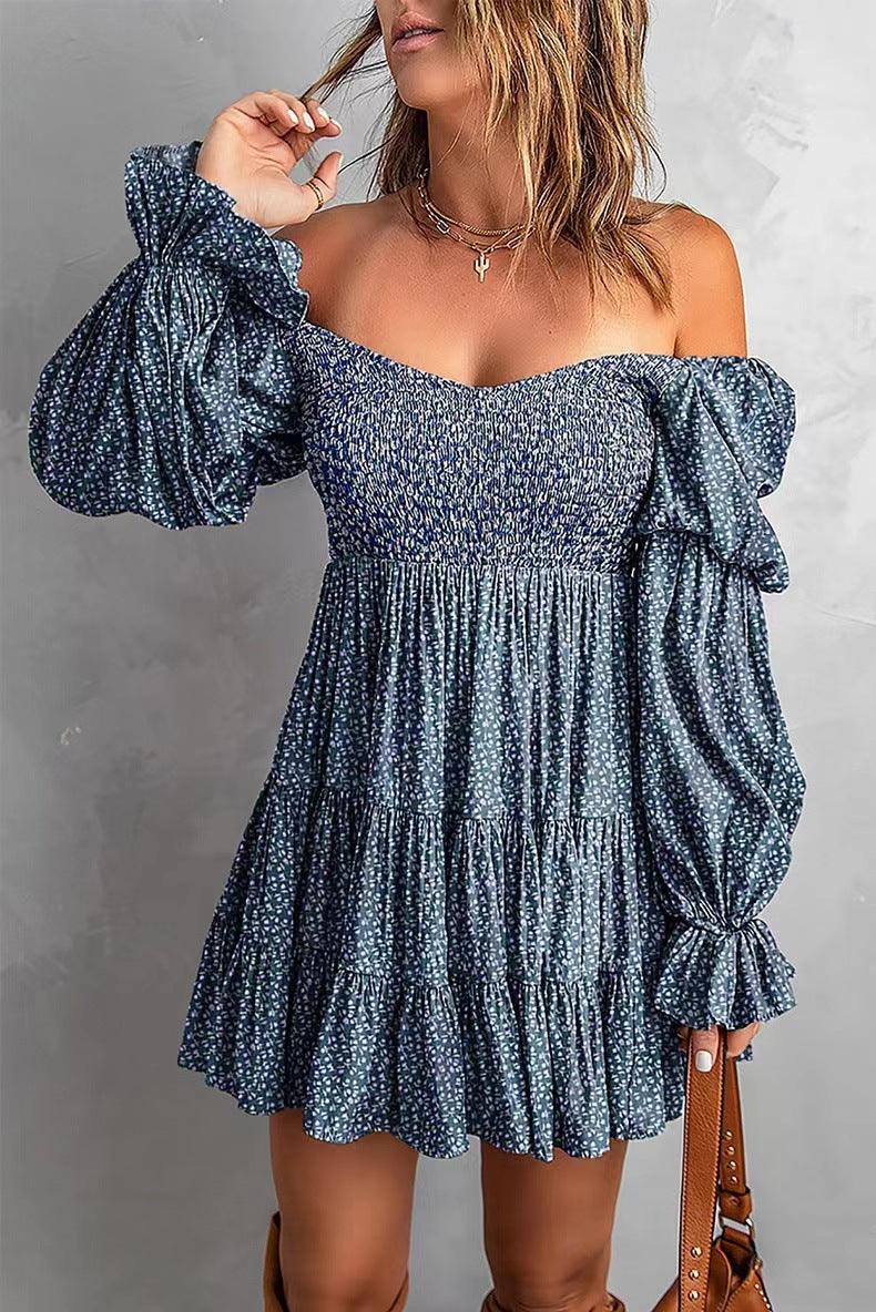 Woman wearing Flirty Puff Sleeve A-Line Dress | Spring & Summer Strapless Dress with puff sleeves, blue print, and fitted bodice.