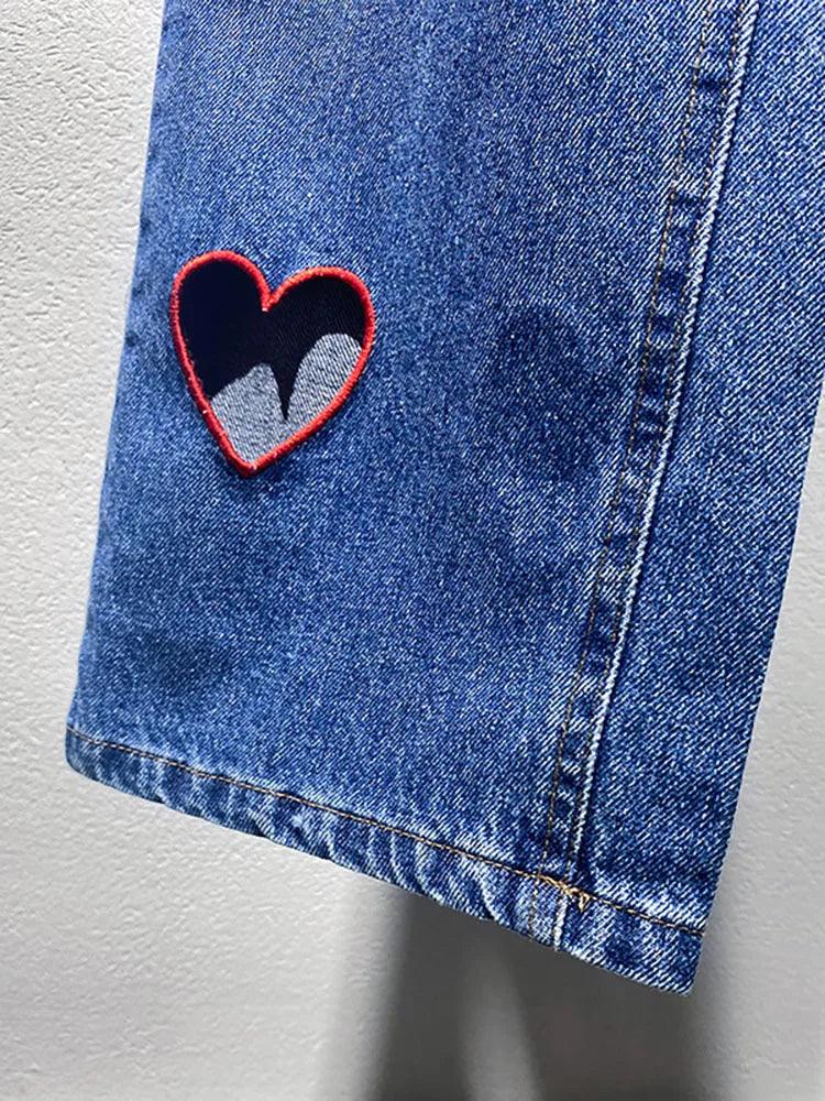 Heart Cutout Wide Leg Jeans | Romantic Wear for Women showcasing embroidered heart-shaped cutout detail on denim.