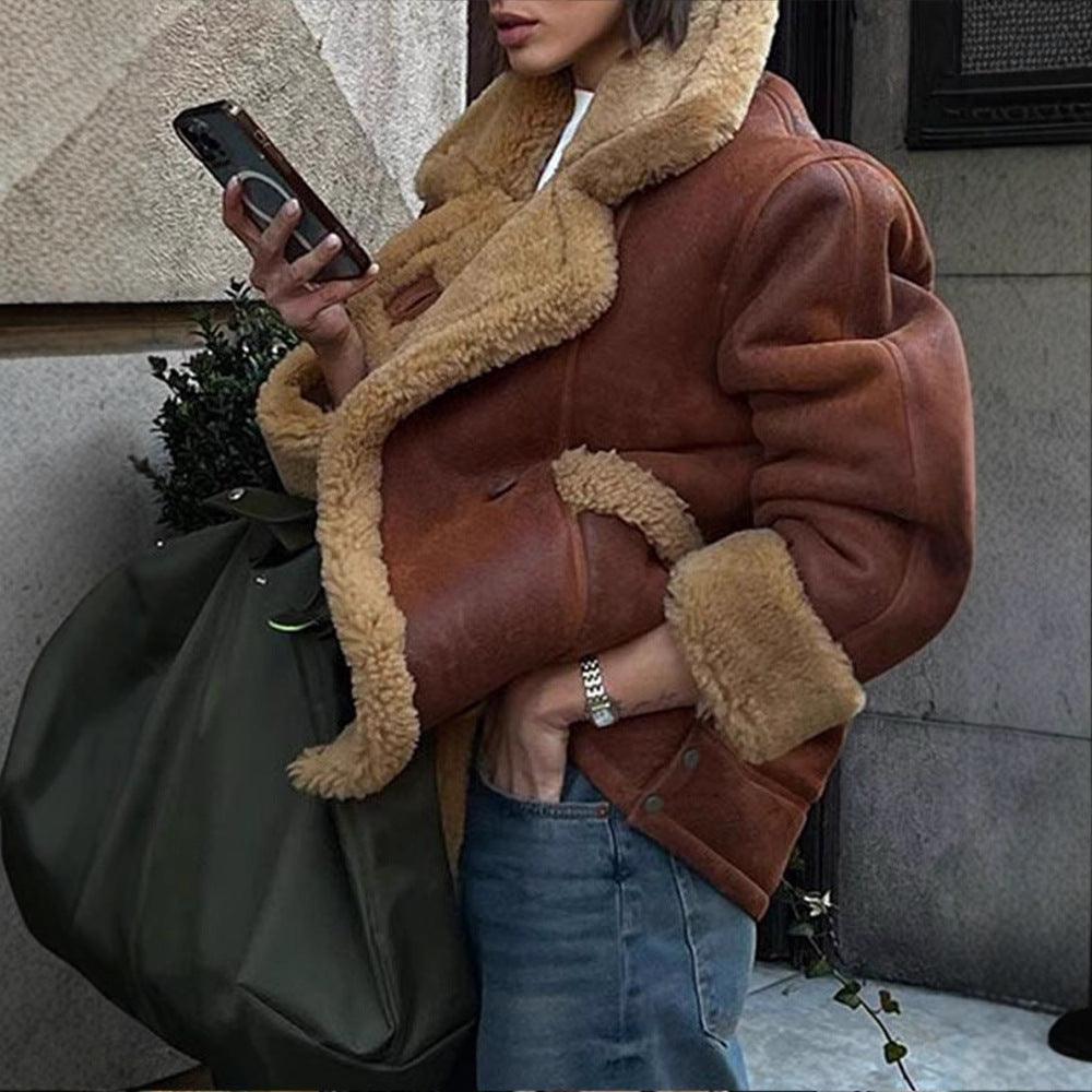 Woman wearing Cozy Cowgirl Lamb's Wool Casual Jacket – Stylish & Comfortable for Cowgirls, holding a phone and bag.