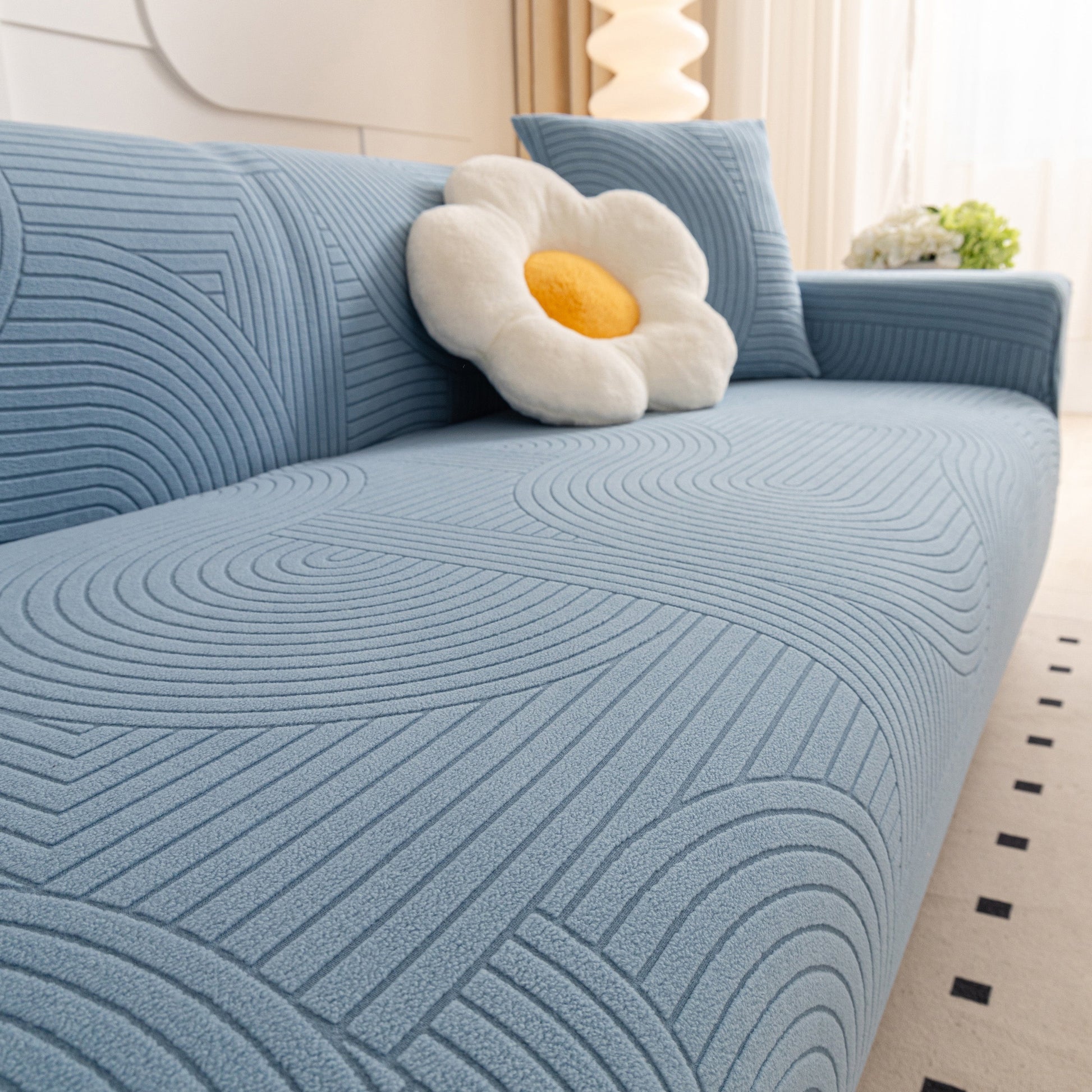 Modern geometric wave pattern on a blue sofa covered with Fleece Stretch Sofa Slipcover Washable Soft Spandex Couch Cover Furniture Protector