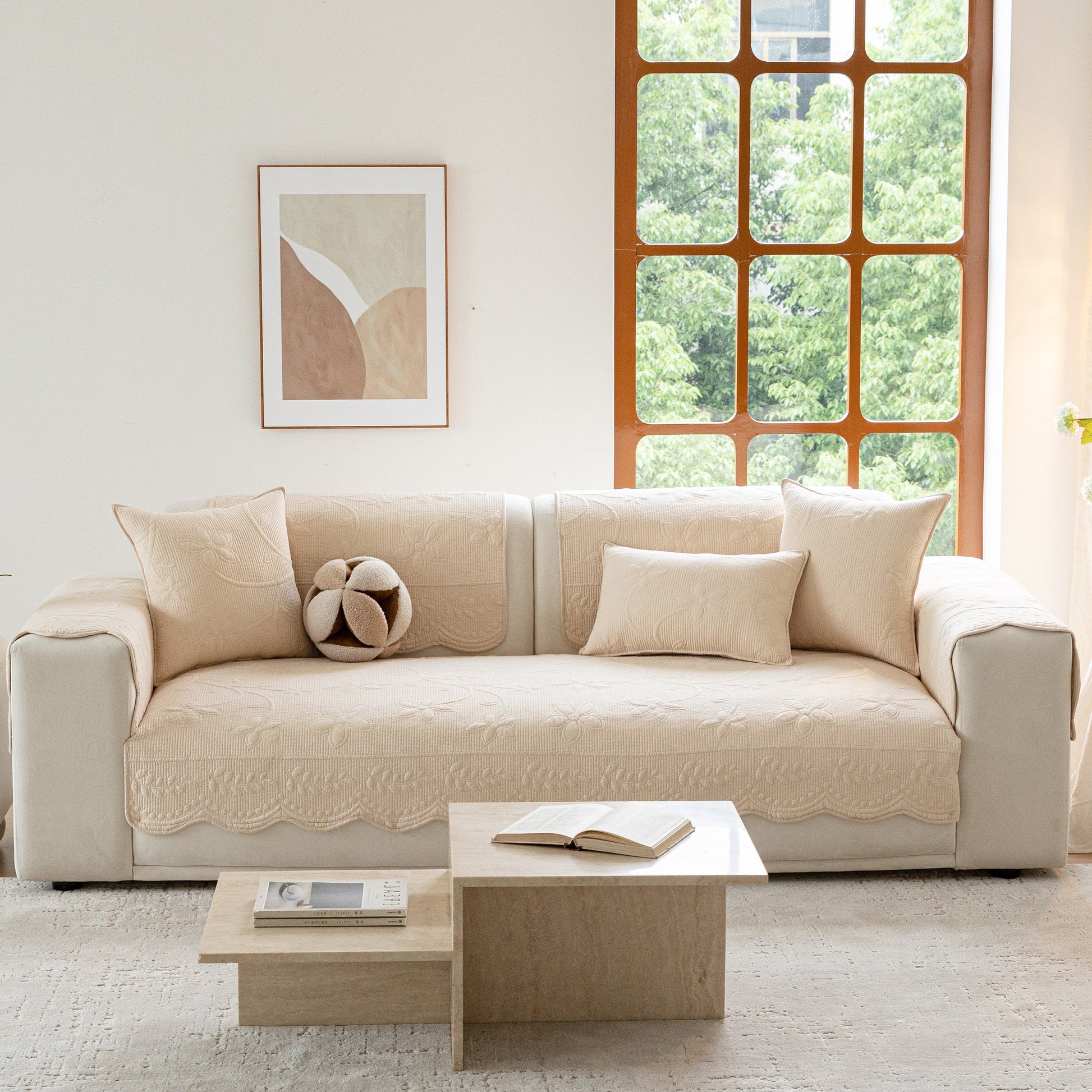 Floral Cotton Quilted Sofa Cover, Non-Slip Couch Protector with Scalloped Edges in living room setting
