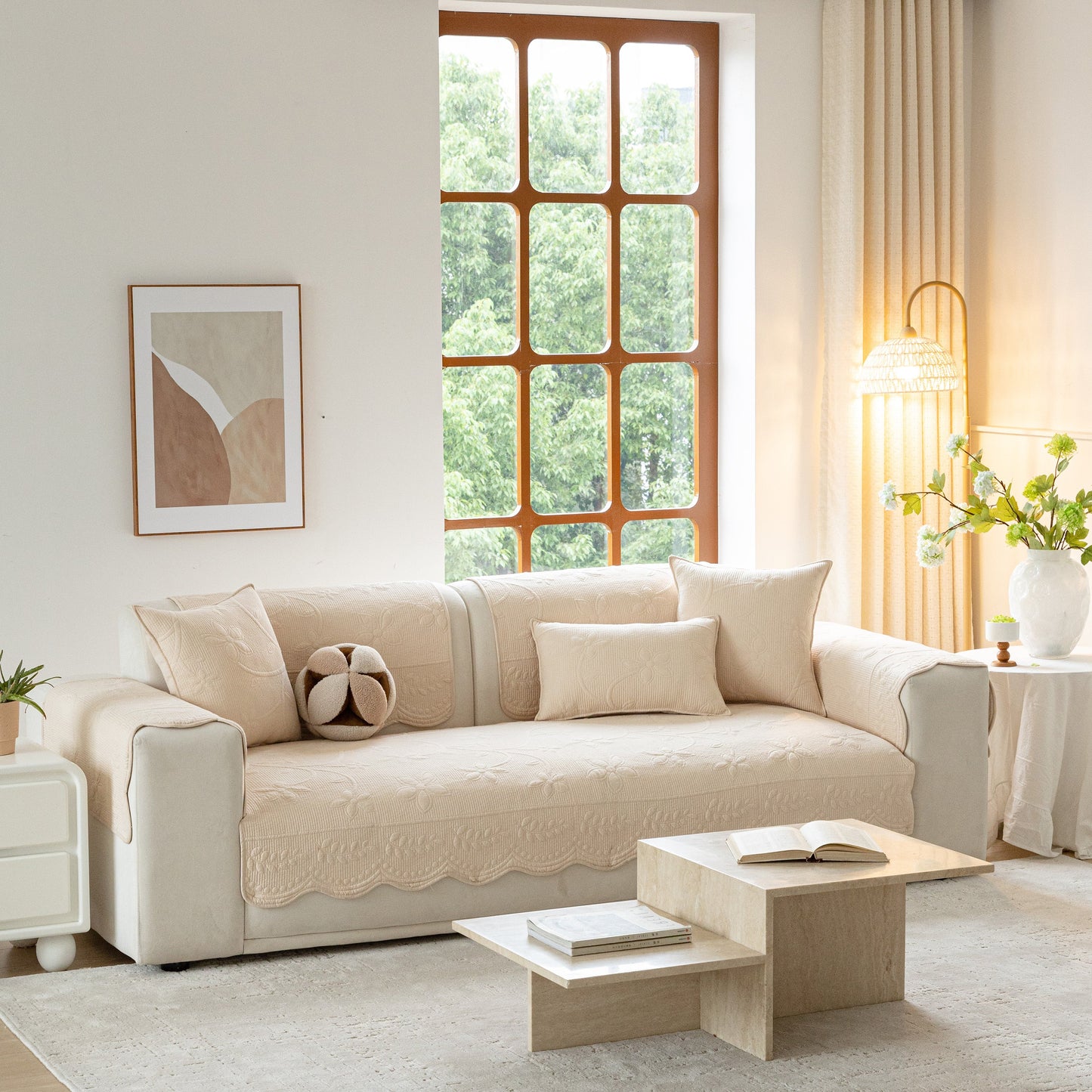 Floral Cotton Quilted Sofa Cover, Non-Slip Couch Protector with Scalloped Edges in a cozy living room setting