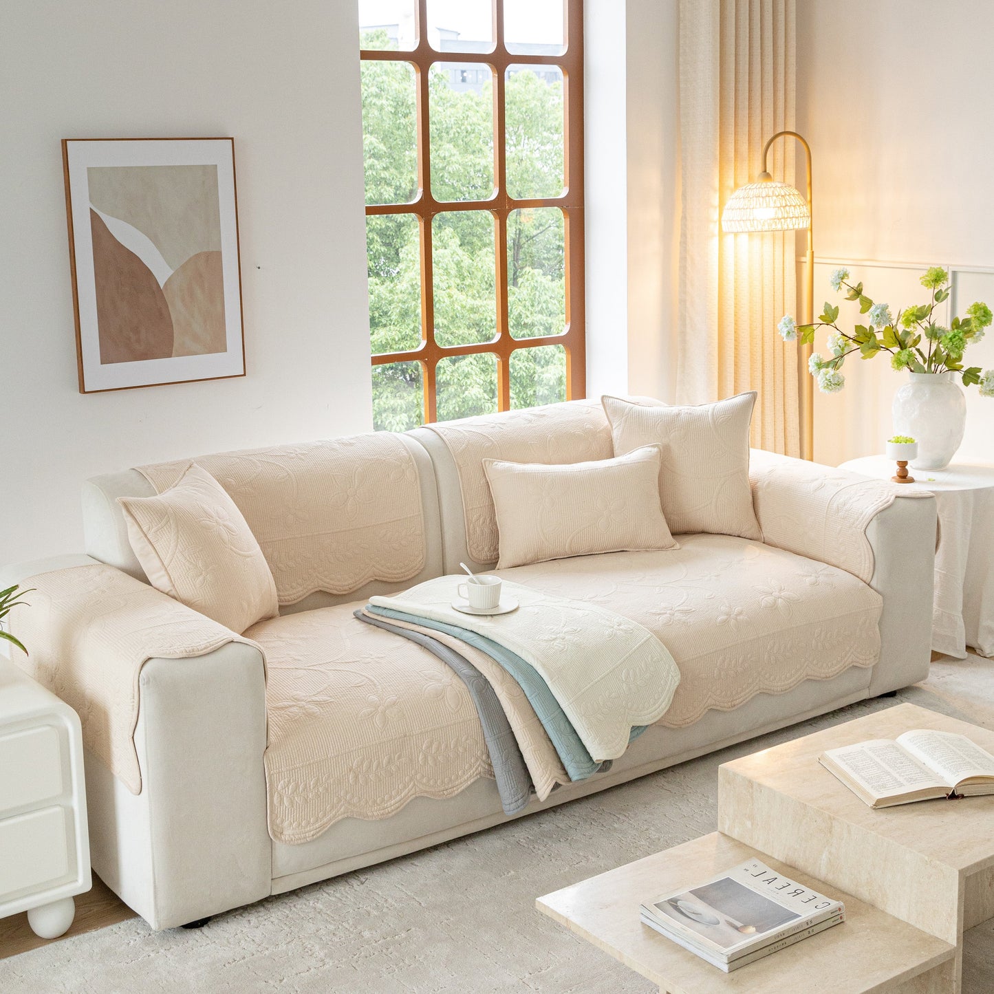 Floral Cotton Quilted Sofa Cover, Non-Slip Couch Protector with scalloped edges in a cozy living room setting.