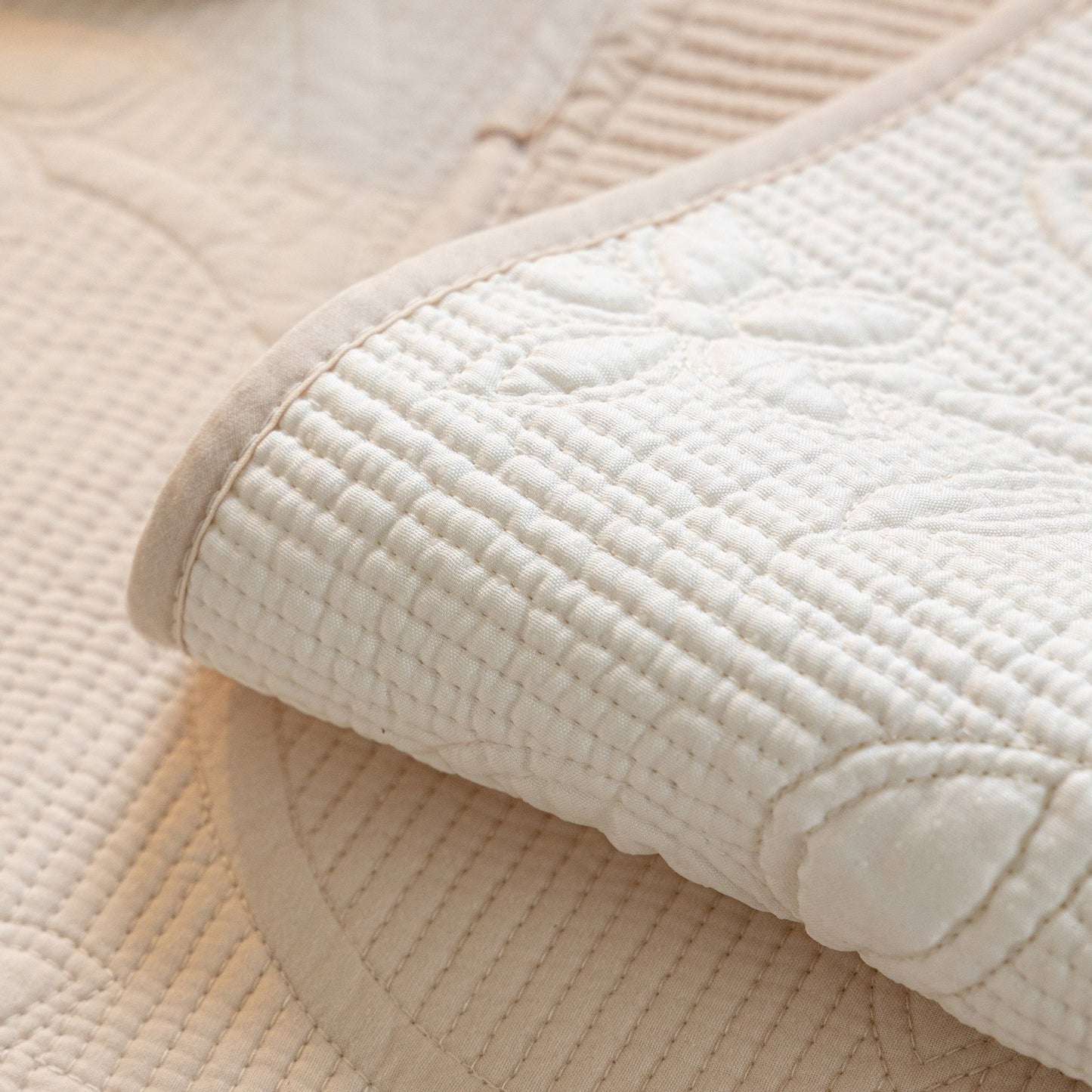 Floral Cotton Quilted Sofa Cover, Non-Slip Couch Protector with Scalloped Edges detail showcasing elegant embroidery and texture