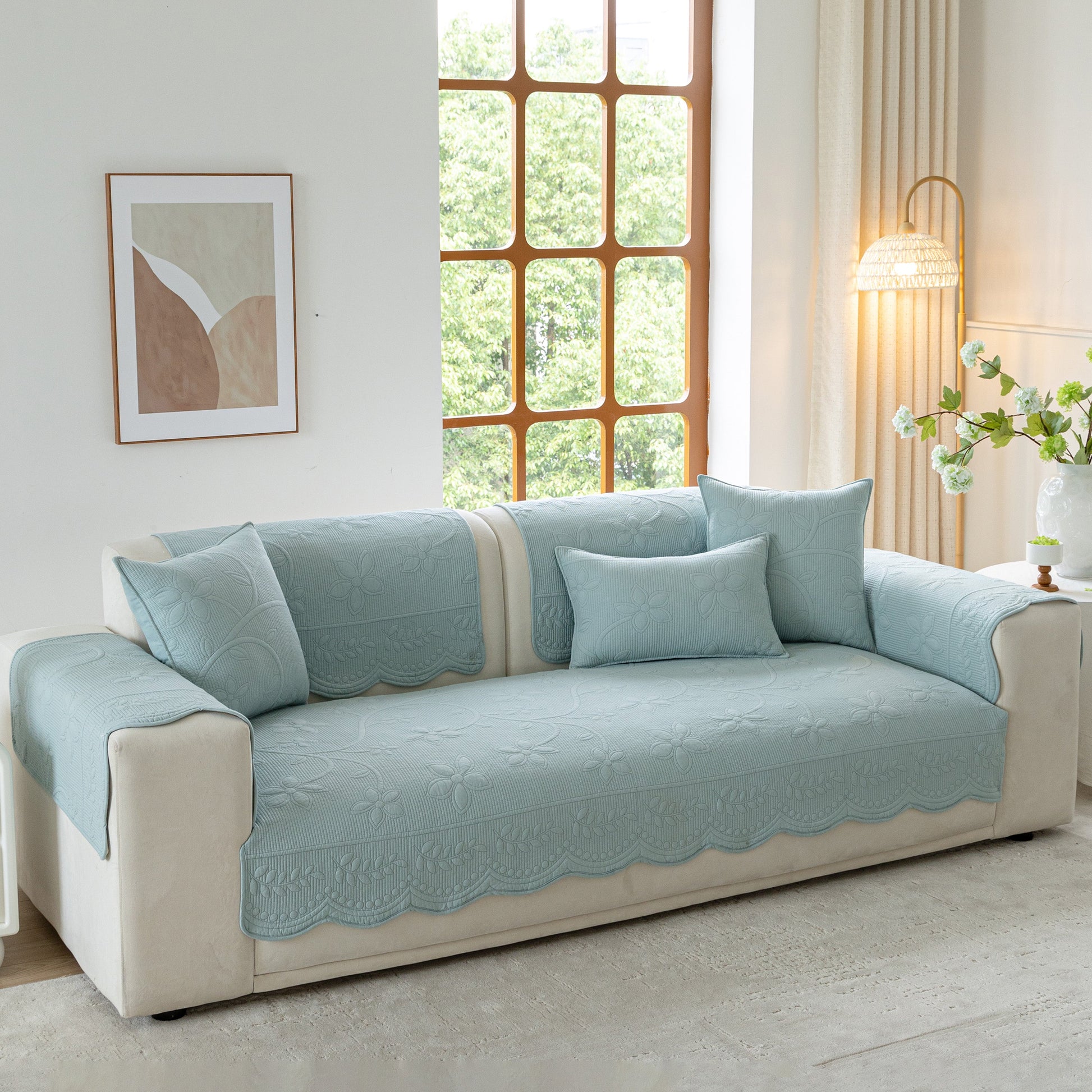 Floral Cotton Quilted Sofa Cover, Non-Slip Couch Protector with Scalloped Edges in elegant living room setting