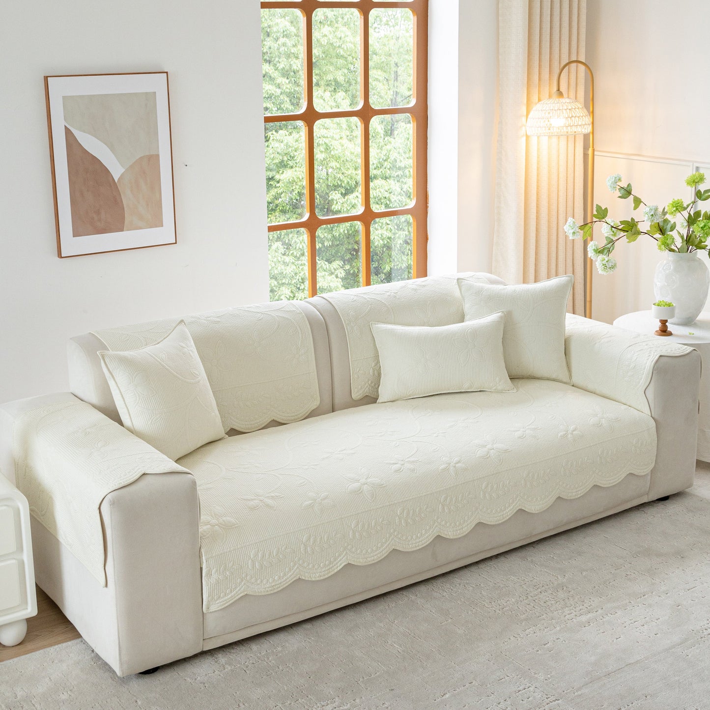 Floral Cotton Quilted Sofa Cover, Non-Slip Couch Protector with Scalloped Edges in a stylish living room setting