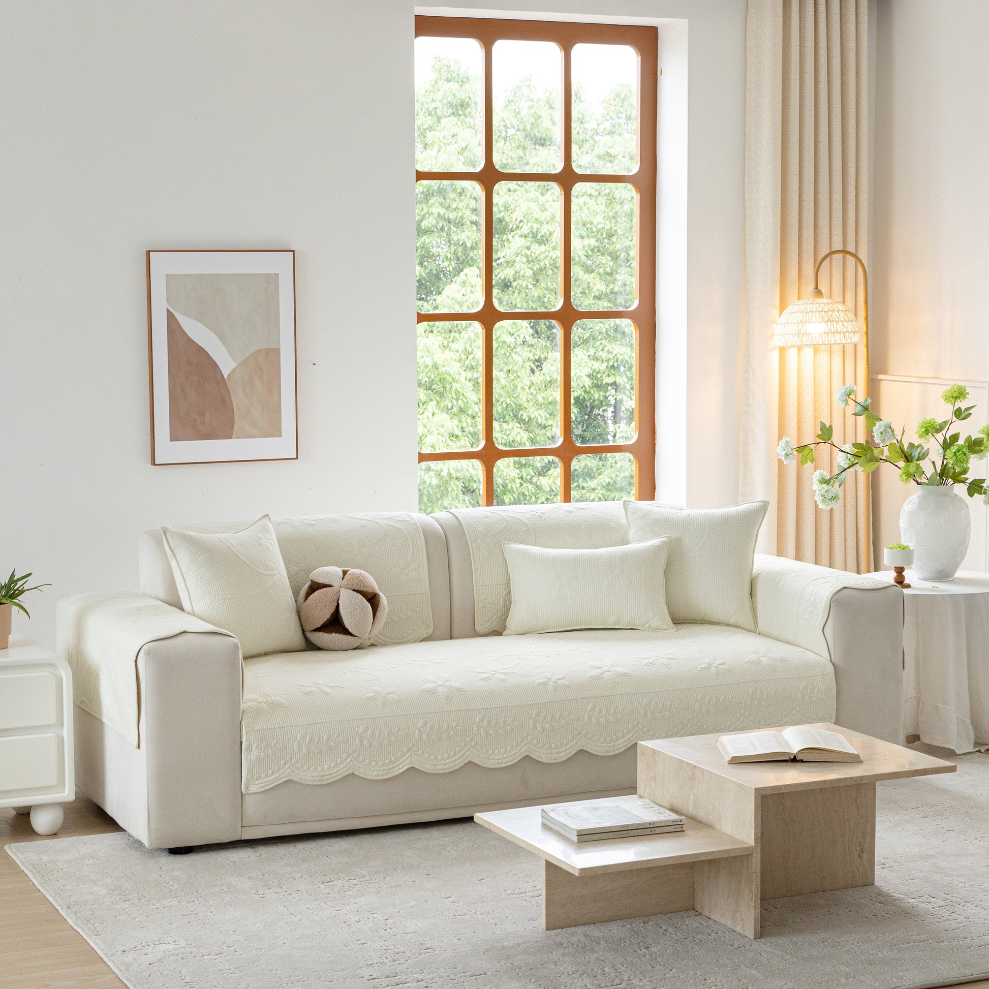 Floral Cotton Quilted Sofa Cover, Non-Slip Couch Protector with Scalloped Edges in elegant living room setting.