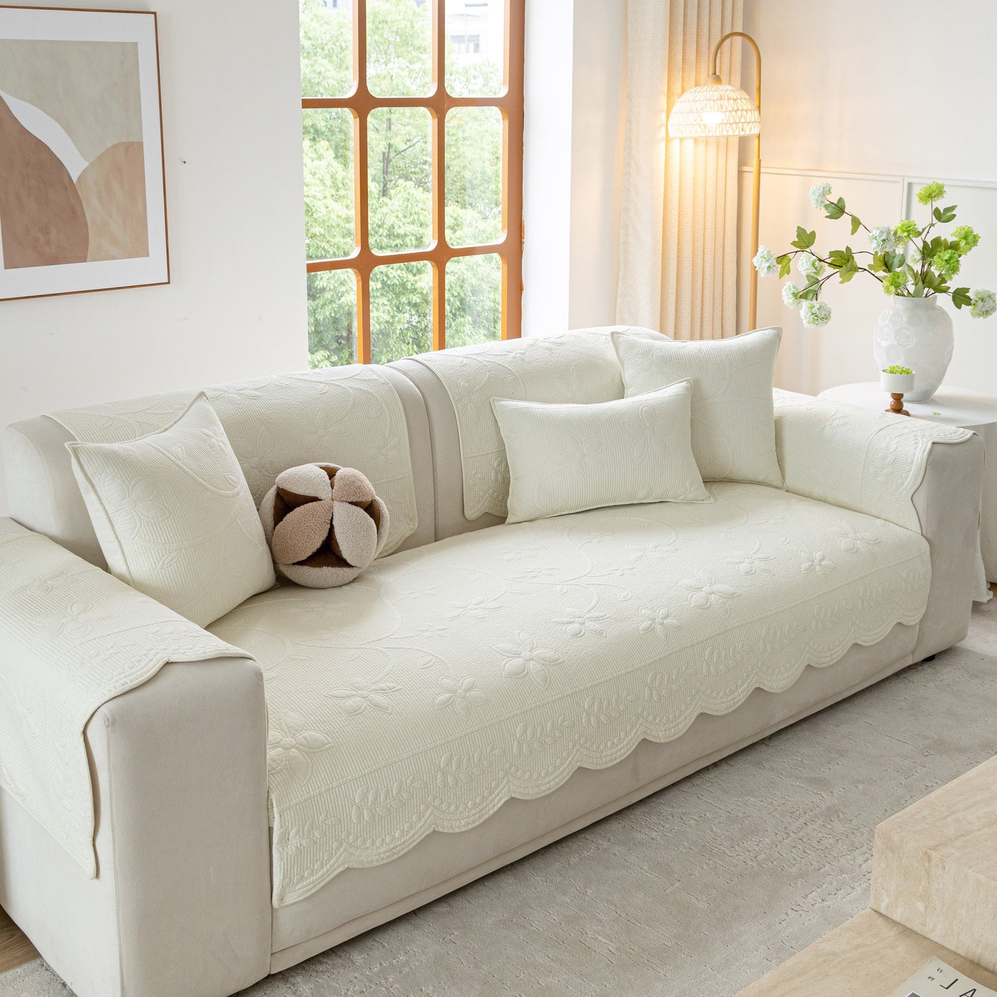 Floral Cotton Quilted Sofa Cover, Non-Slip Couch Protector with Scalloped Edges in modern living room setting