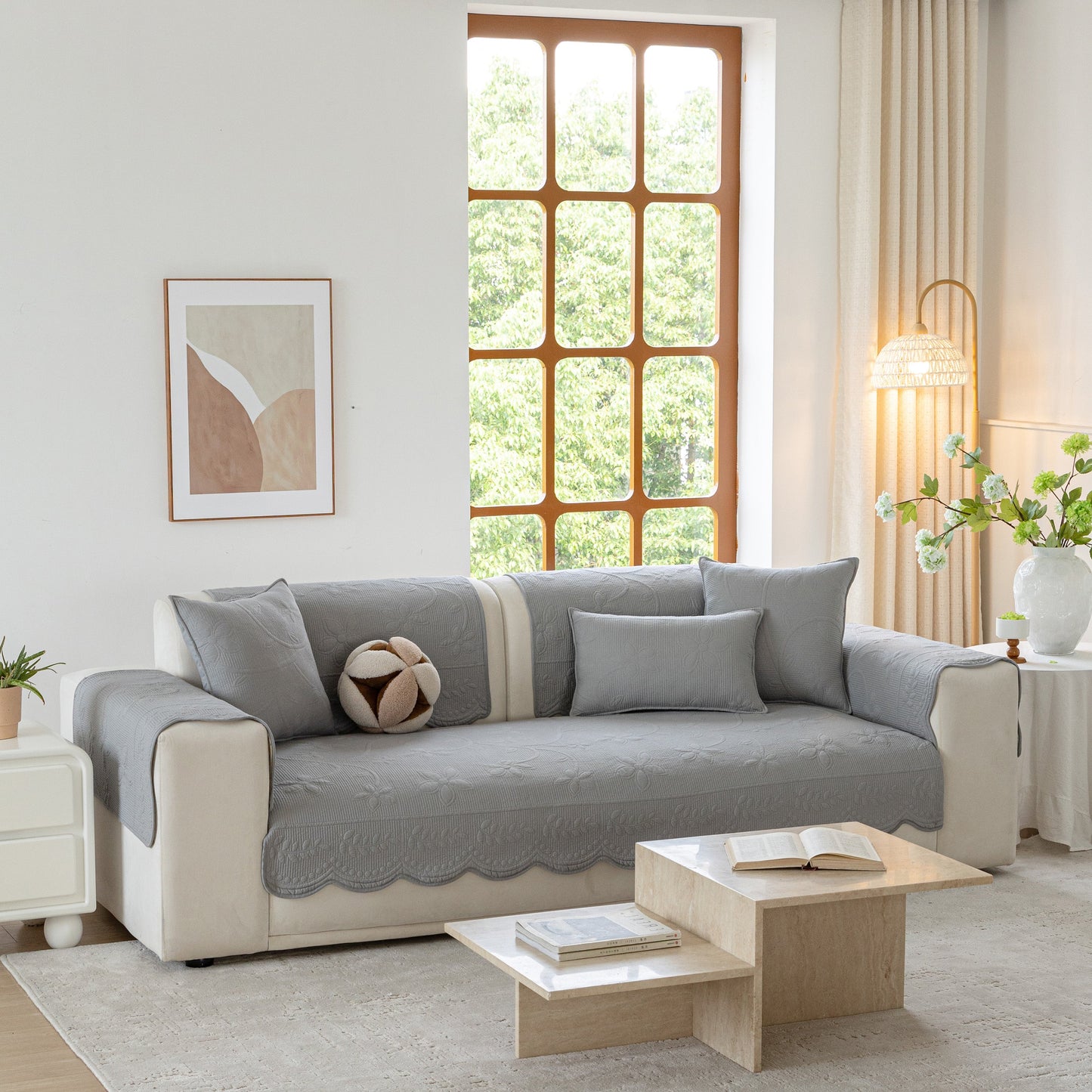 Living room featuring Floral Cotton Quilted Sofa Cover, Non-Slip Couch Protector with Scalloped Edges in cozy setting.