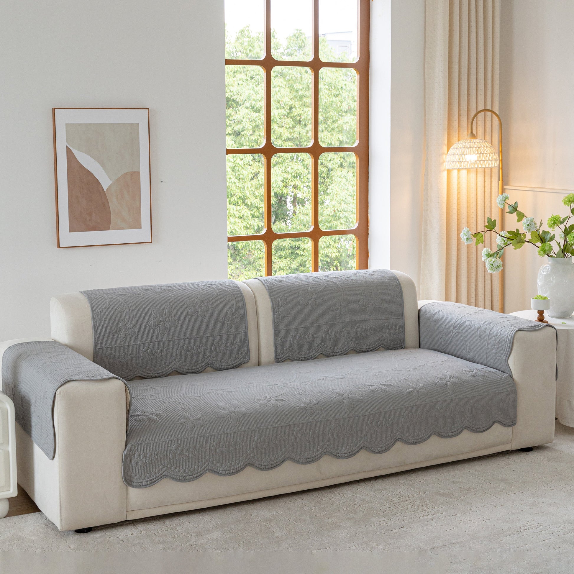 Floral Cotton Quilted Sofa Cover, Non-Slip Couch Protector with Scalloped Edges in living room