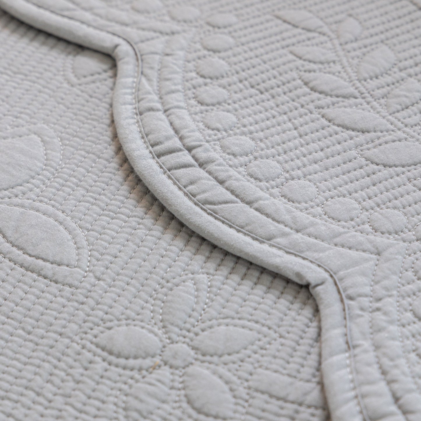 Floral Cotton Quilted Sofa Cover, Non-Slip Couch Protector with Scalloped Edges detail view