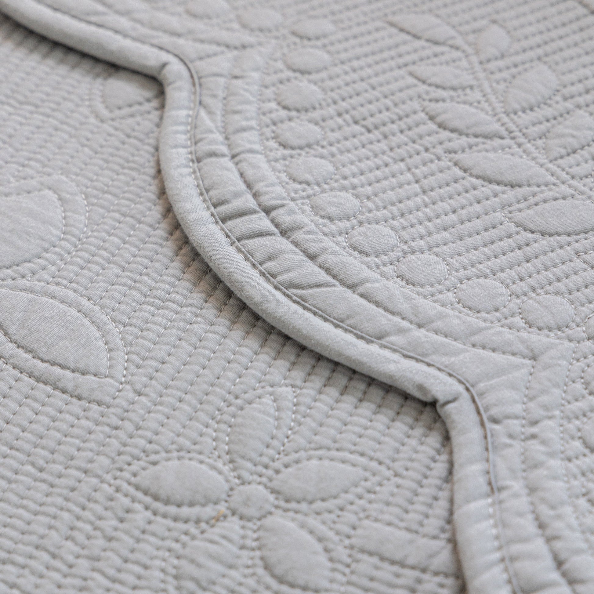 Floral Cotton Quilted Sofa Cover, Non-Slip Couch Protector with Scalloped Edges detail view