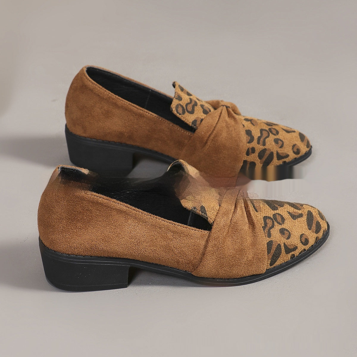 Women’s Leopard Print Pumps with bow accent and casual flair, perfect bold fashion statement for versatile styling.