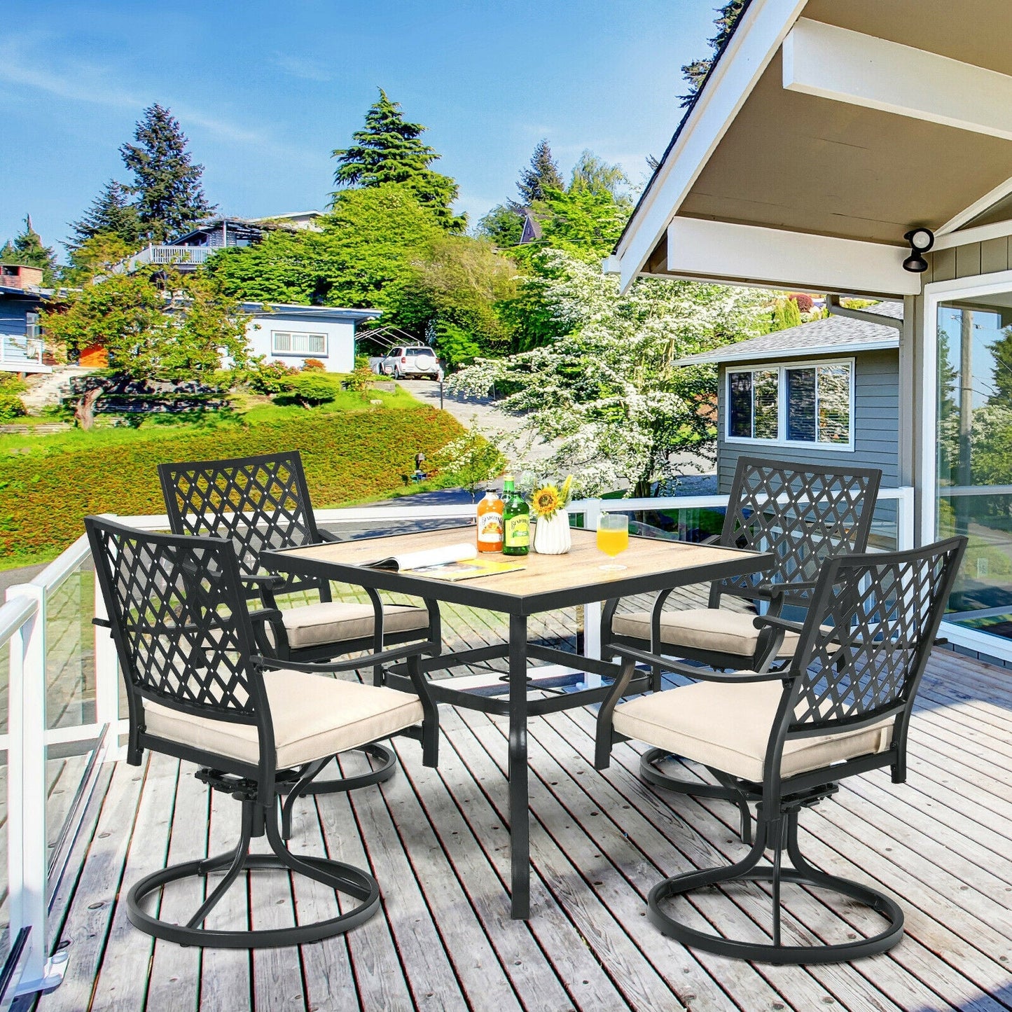 5-Piece Outdoor Patio Dining Set with Soft Cushions on a deck with swivel chairs and square table, suitable for garden or poolside