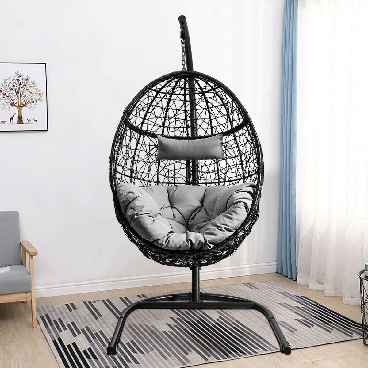 Stylish Hanging Cushioned Hammock Chair with Stand -Gray indoors, featuring a rugged frame and comfy cushions for relaxation and stability.