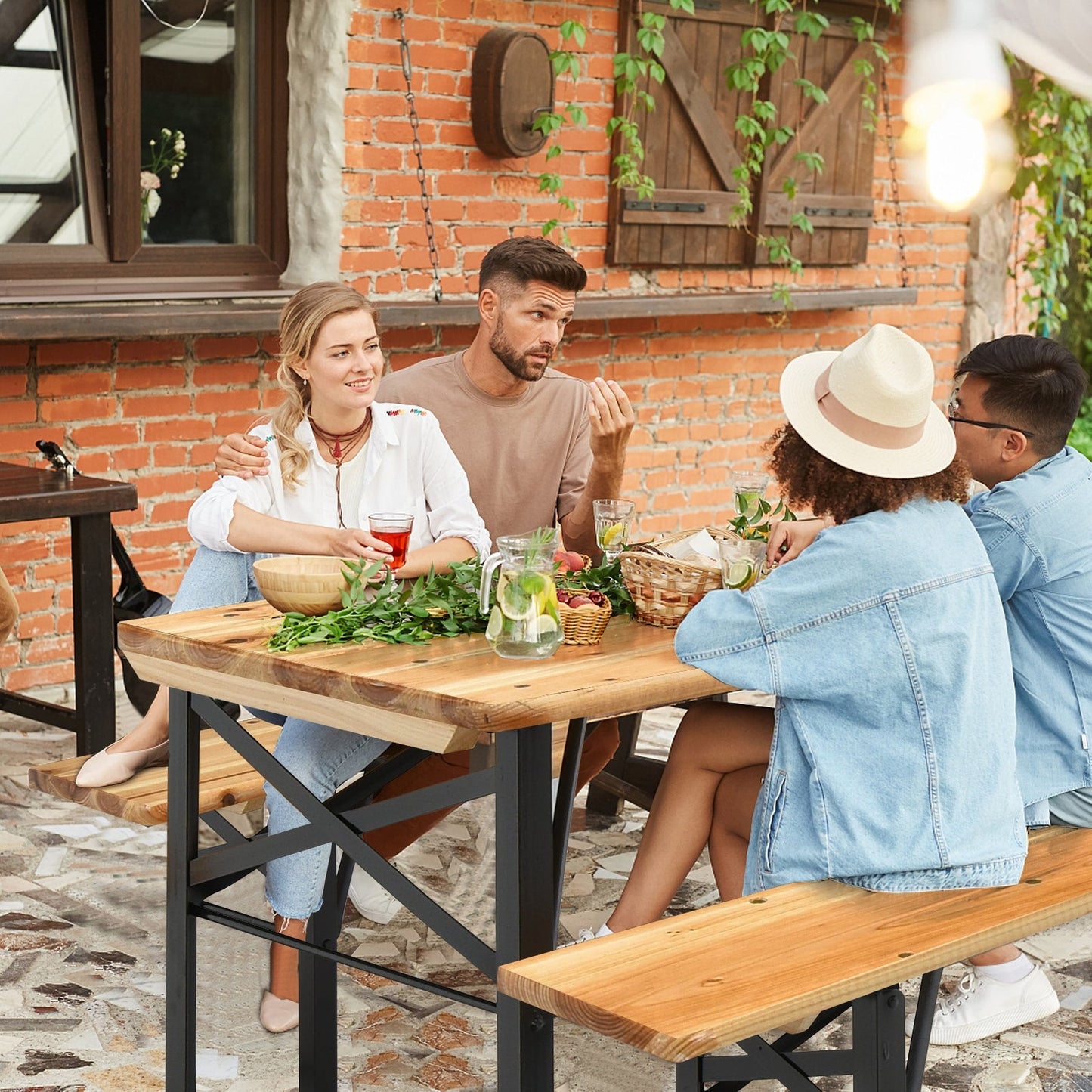Outdoor gathering around 3 Pieces Folding Wooden Picnic Table Bench Set with friends enjoying drinks and snacks.